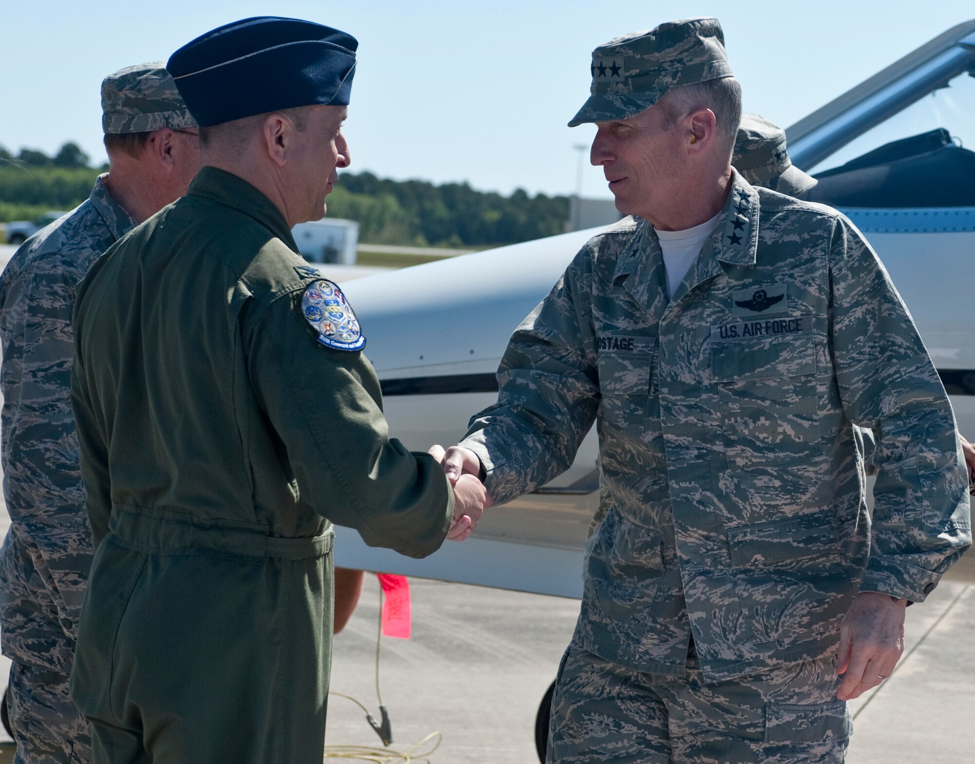 Col. Mustafa Koprucu, commander of the 505th Command and Control Wing, greets Gen. Michael Hostage, commander of Air Combat Command, on the flightline at Hurlburt Field, Fla., April 24, 2012. The 505th Command and Control Wing is a subordinate unit of the U.S. Air Force Warfare Center and an ACC asset. (U.S. Air Force photo/Airman 1st Class Hayden K. Hyatt)