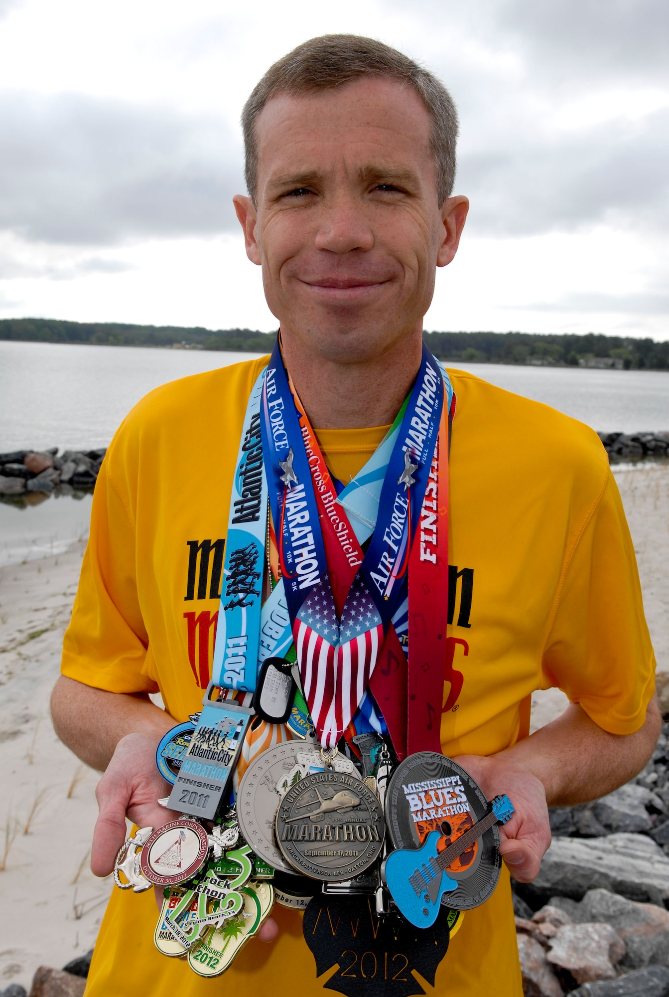 U.S. Air Force Maj. Joel Fenlason, Air Combat Command Contingency & Readiness Branch chief, displays more than 20 medals from various marathons he completed throughout the past year, Apr. 20, 2012. Fenlason is preparing to run in his 50th marathon in Kalamazoo, Mich., this May. (U.S. Air Force photo by Senior Airman Wesley Farnsworth)