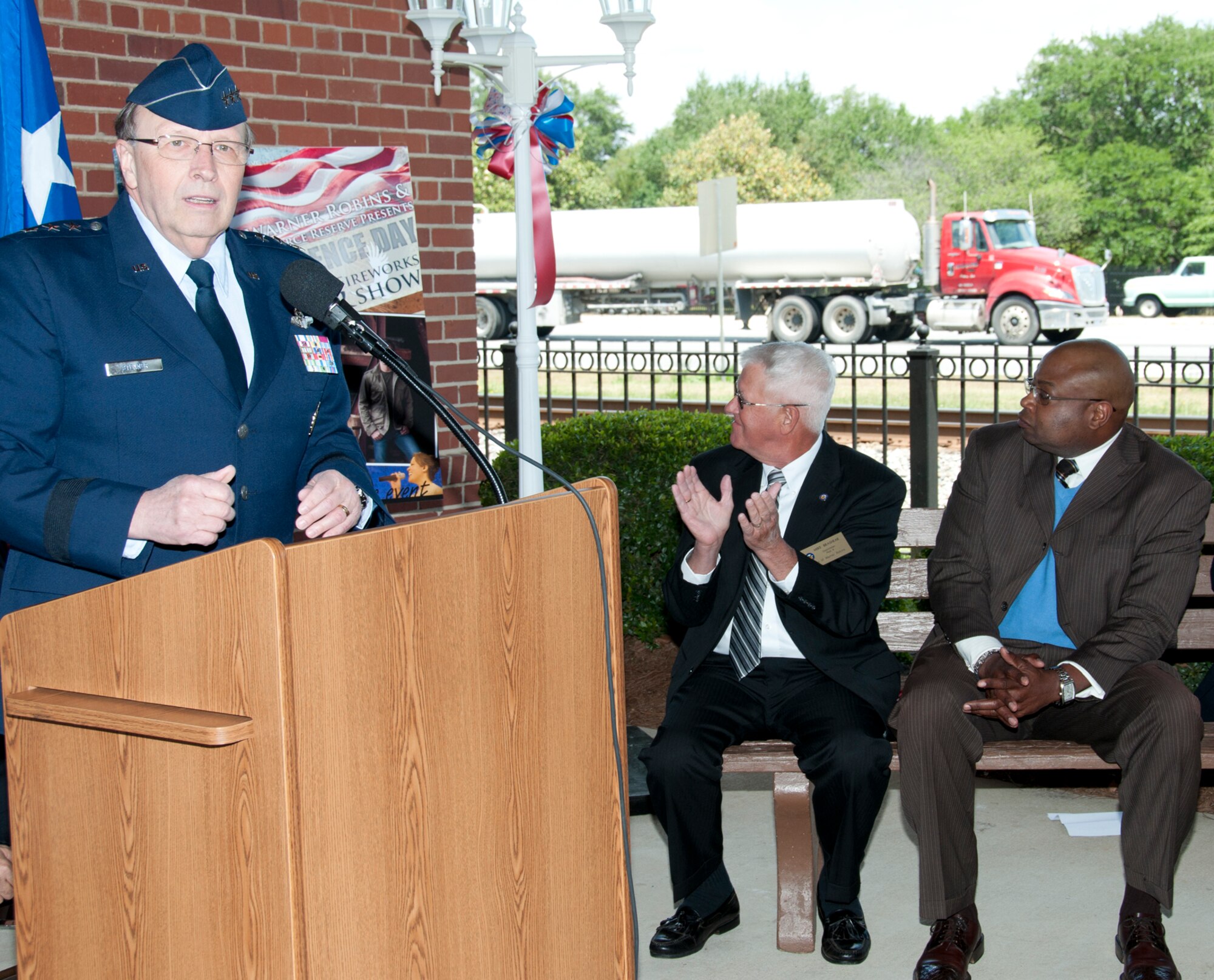 Lt. Gen. Charles E. Stenner, Jr., commander of Air Force Reserve Command, unveils the entertainment for the 2012 Independence Day Celebration as members of the Warner Robins City Council observe. Stenner made the announcement at the city's visitor center across from Robins Air Force Base, Ga., on April 24. This year Country superstar Josh Turner will headline the July 2 event at McConnell Talbert Memorial Stadium. Turner's fourth number-one single "All Over Me" was named 2011 BMI Song of the Year. Also performing will be Staff Sgt. Angie Johnson, performing with the Band of the U.S. Air Force Reserve. Johnson, a member of the Missouri Air National Guard band, rose to fame when the Guard band was featured in a video that went viral on YouTube, drawing more than 1.2 million hits. That video led to her appearance on late-night talk shows, The Voice television show as well as the Guard band's performance at the White House. (U.S. Air Force photo/Staff Sgt. Alexi Saltekoff)