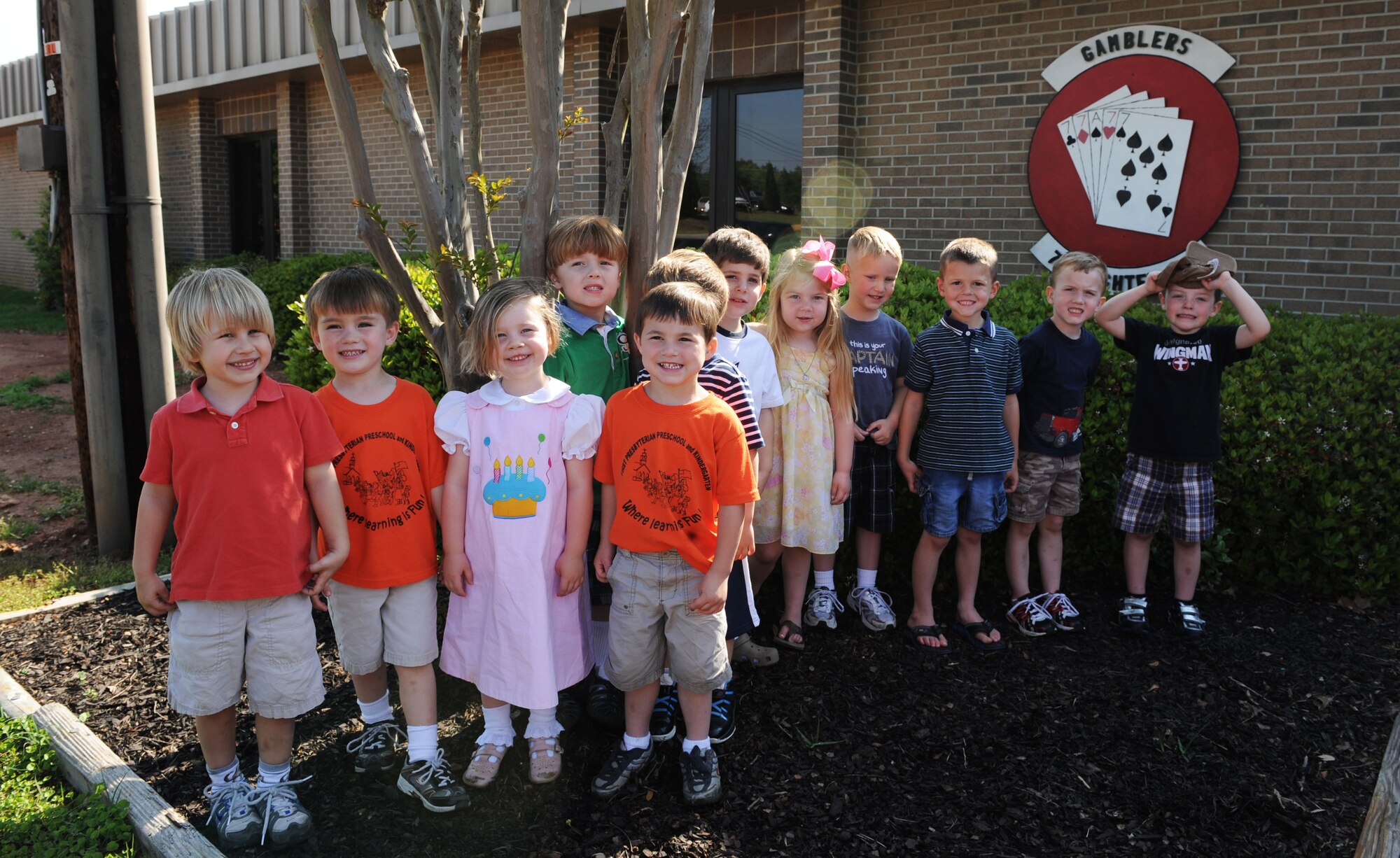 First Presbyterian Preschool class poses for a picture in front of the 77th Fighter Squadron during a tour of the flight line and the 77th Fighter Squadron at Shaw Air Force Base, S.C., March 30, 2012. The month of April is the Month of the Military Child. During this month, numerous events are held for children to recognize the sacrifices of children in military families. (U.S. Air Force photo by Senior Airman Tabatha McCarthy/released)