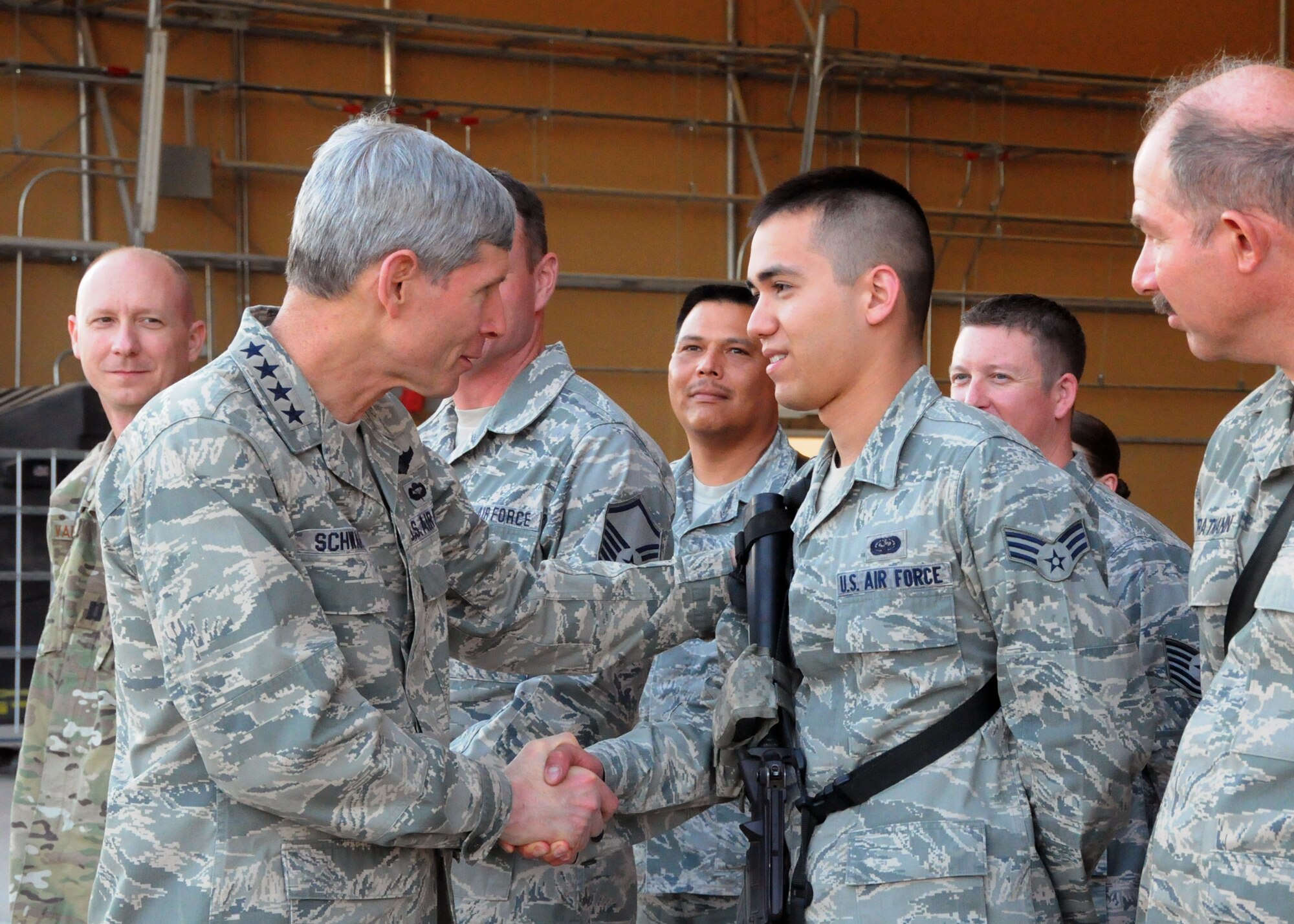 Air Force Chief of Staff Gen. Norton Schwartz greets Senior Airman Glenn Brown, a 451st Expeditionary Maintenance Group knowledge operator deployed from Patrick Air Force Base, Fla., during a visit to Kandahar Airfield, Afghanistan, April 24, 2012. Schwartz said his goal during the visit to Afghanistan was to meet and talk with as many deployed Airmen as possible.  (U.S. Air Force photo/Staff Sgt. Heather Skinkle)
