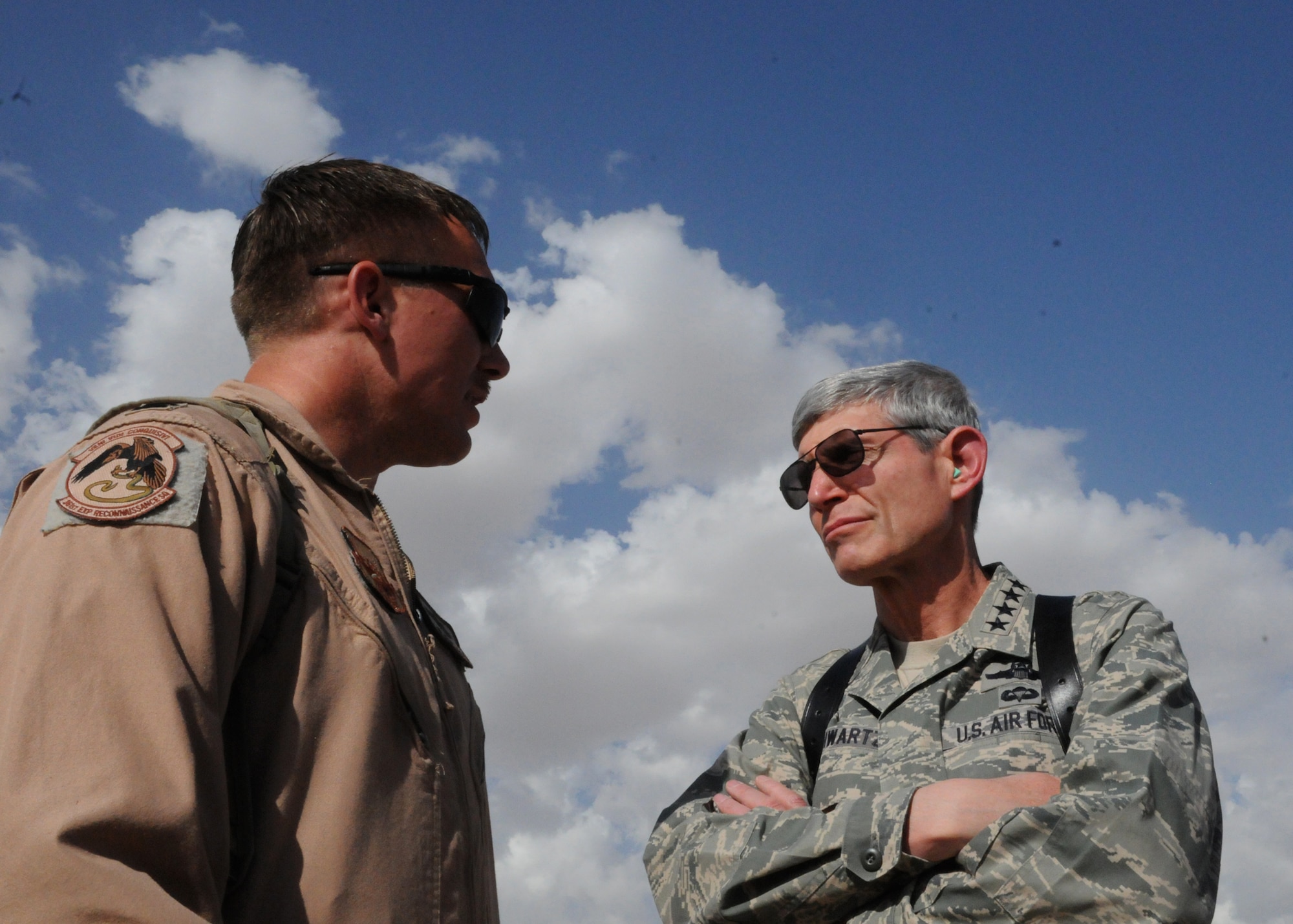 Capt. Joseph Markowski, 361st Expeditionary Reconaissance Squadron MC-12W pilot and mission commander, briefs Air Force Chief of Staff Gen. Norton Schwartz on the 451st Expeditionary Operations Group’s various missions at Kandahar Airfield, Afghanistan, April 24, 2012. Schwartz said his goal during the visit to Afghanistan was to meet and talk with as many deployed Airmen as possible.  (U.S. Air Force photo/Staff Sgt. Heather Skinkle)