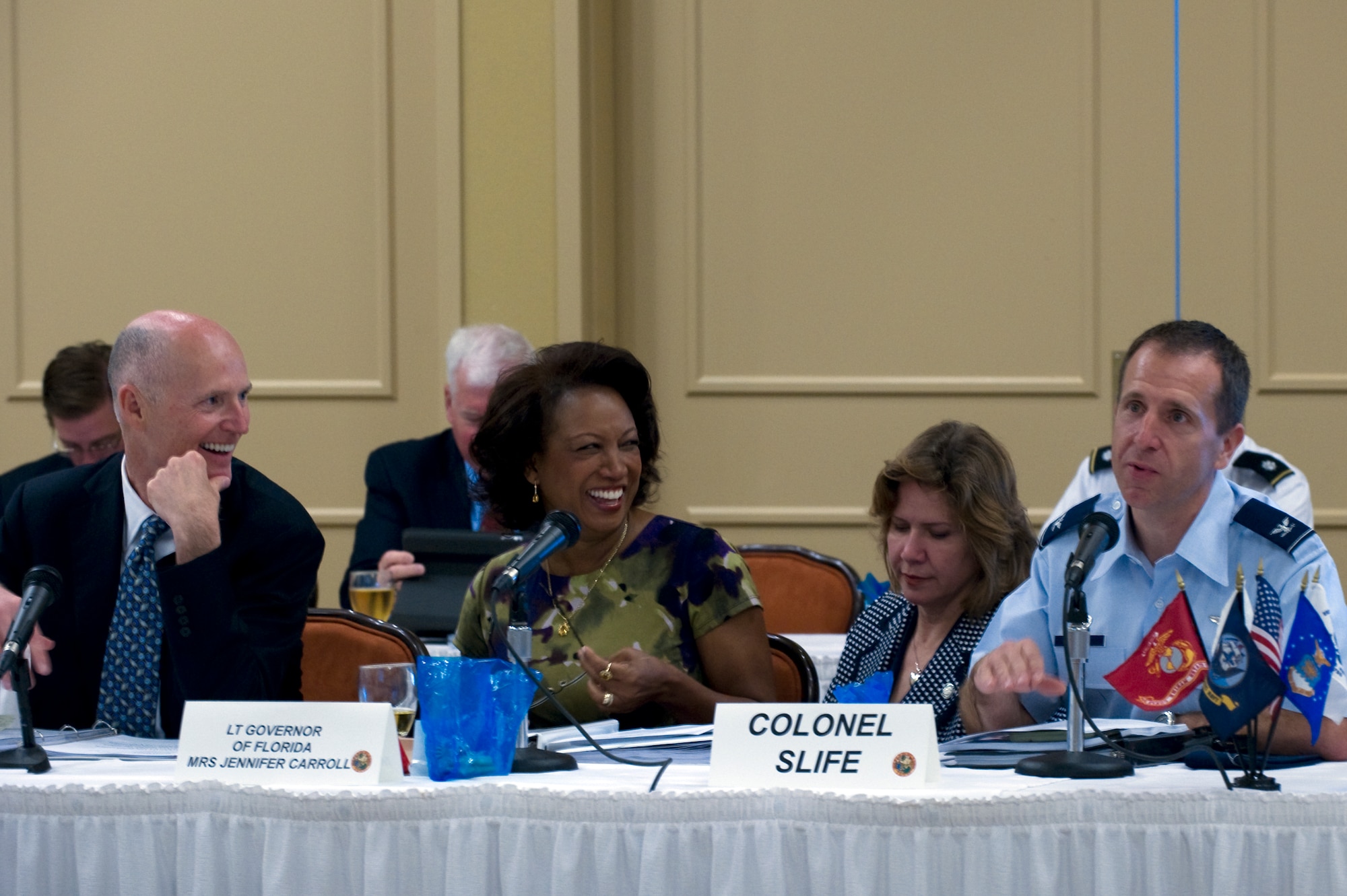 Col. Jim Slife, commander of 1st Special Operations Wing, briefs the wing mission at the base commanders meeting with Rick Scott, governor of Florida, and Jennifer Carroll, lieutenant governor of Florida, at the Soundside Club on Hurlburt Field, Fla., April 11, 2012. More than 20 base commanders from throughout Florida come together quarterly to discuss base improvements and challenges. (U.S. Air Force photo/Senior Airman Eboni Reams) 

