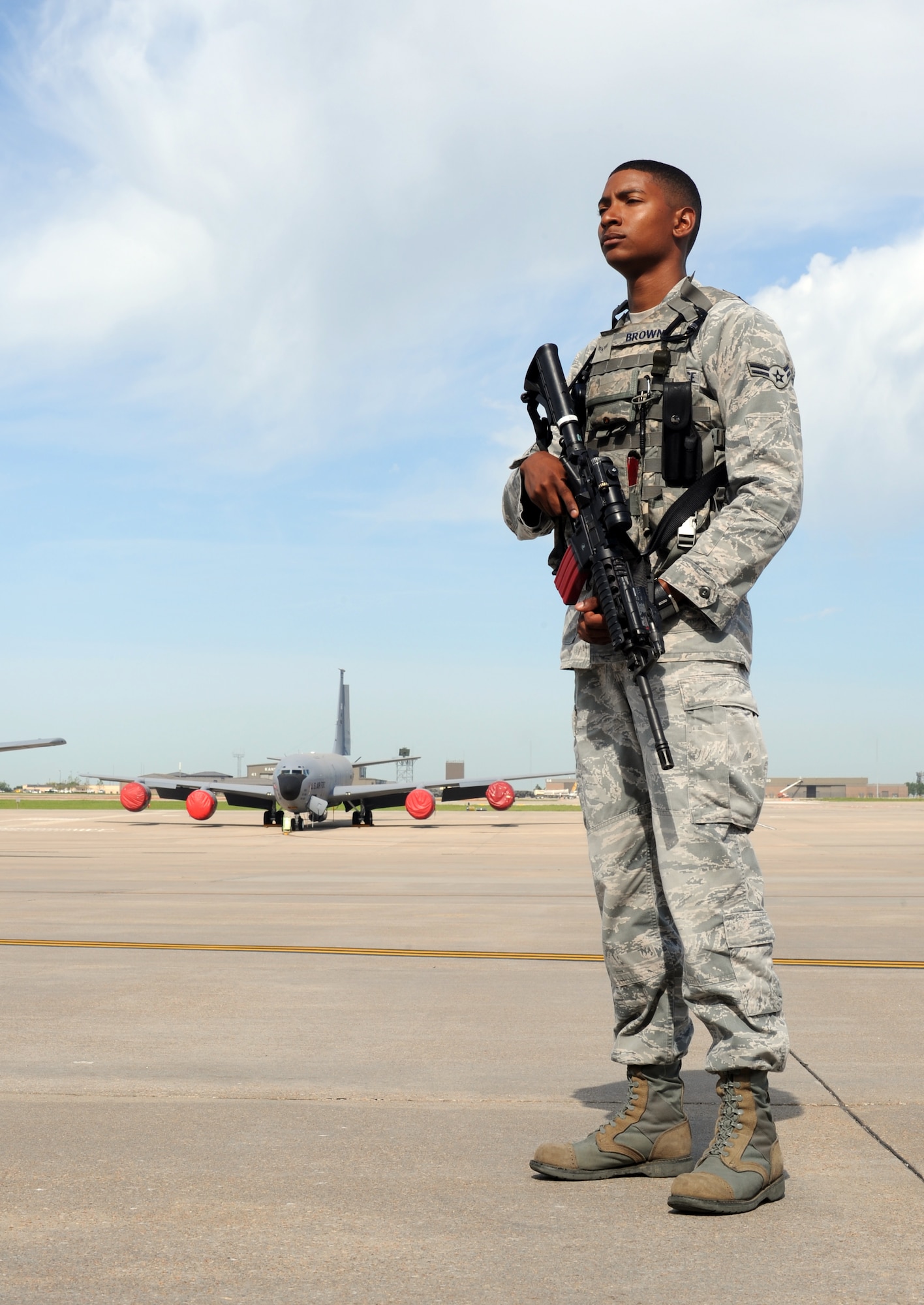 Airman 1st Class Giordan Brown, 22nd Security Forces Squadron installation entry controller, guards KC-135 Stratotankers on the flight line April 25, 2012, McConnell Air Force Base, Kan. As an entry controller, Brown is responsible for providing security for base personnel and resources. Brown was chosen as the 22nd SFS spotlight performer of the week, April 16-20. (U. S. Air Force photo/ Airman 1st Class Jose L. Leon)