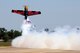 Five-time U.S. National Aerobatic champion Kirby Chambliss performs aerial acrobatics in a Zivko Edge 540 aircraft during the 2012 Barksdale Air Force Base Defenders of Liberty Air Show April 22. The aircraft is capable of a 420 degree per second roll rate and a 3,700 feet per minute climb rate. (U.S. Air Force photo/Senior Airman La'Shanette V. Garrett)(RELEASED)
