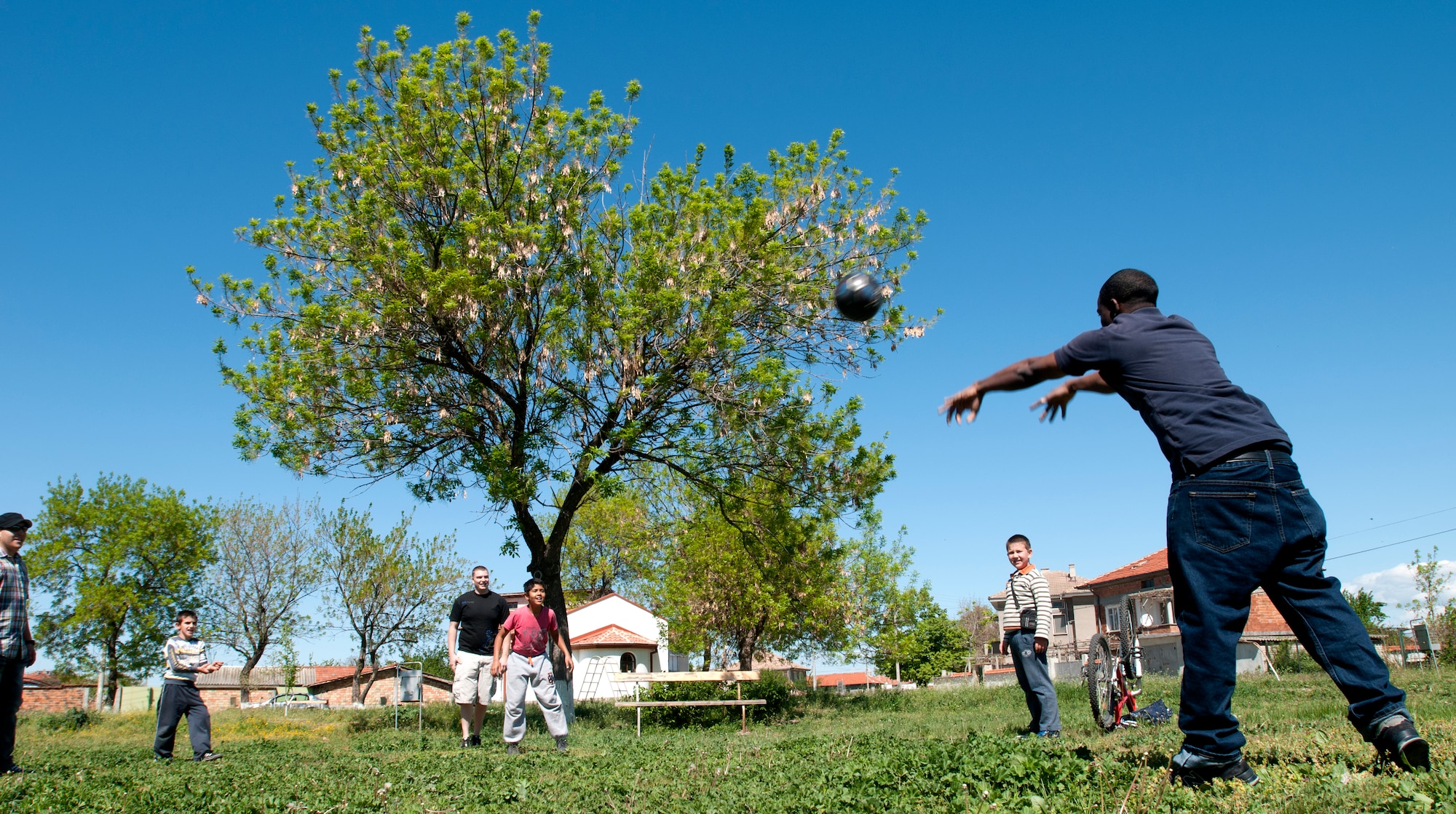U.S. Air Force members play soccer with Bulgarian children April 22, 2012, in Graf Ignatievo, Bulgaria. More than 150 U.S. and Bulgarian air force members volunteered their off-duty time to refurbish playground equipment and build a soccer field at a village playground. Volunteers cleaned and painted playground equipment and raked, supplied new goals, cleaned and laid grass seed down in a field. U.S. Air Force members are deployed from the 31st Fighter Wing at Aviano Air Base, Italy, to Graf Ignatievo Air Force Base in support of Thracian Star 2012, a bilateral coalition training exercise geared towards strengthening partnerships and improving interoperability between NATO allies. (U.S. Air Force photo/Senior Airman Katherine Windish)