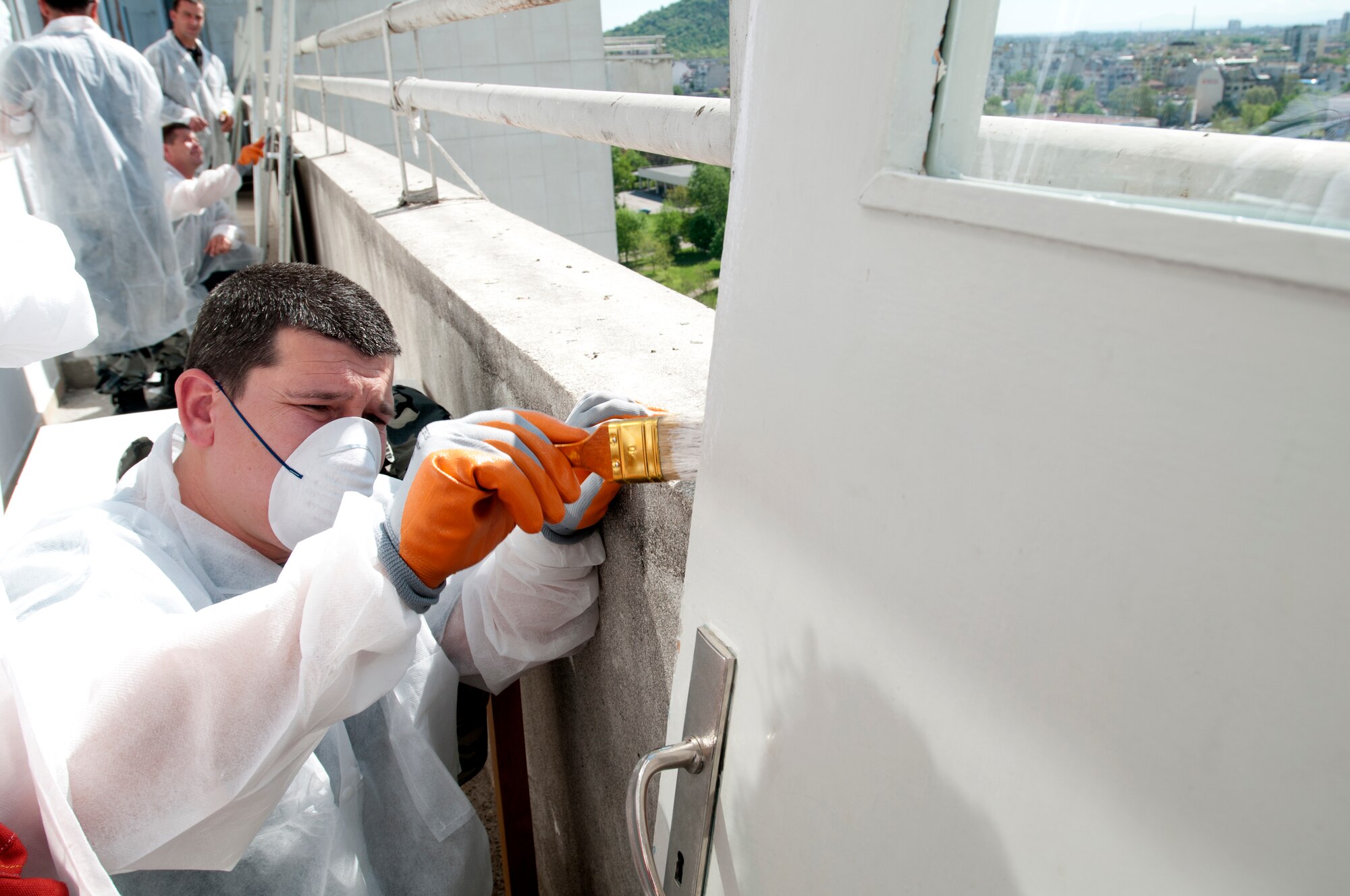 Bulgarian air force Sgt. Dean Genov paints a door in St. George's University pediatric surgery department April 21, 2012, in Plovdiv, Bulgaria. The hospital has one of only two pediatric surgery departments in the country. U.S. Air Force members deployed from the 31st Fighter Wing at Aviano Air Base, Italy, to Graf Ignatievo Air Force Base, Bulgaria for the month-long Thracian Star 2012 exercise, spent their off-duty time working alongside Bulgarian air force members to clean, paint and decorate post-operation rooms in the children's wing. (U.S. Air Force photo/Senior Airman Katherine Windish)