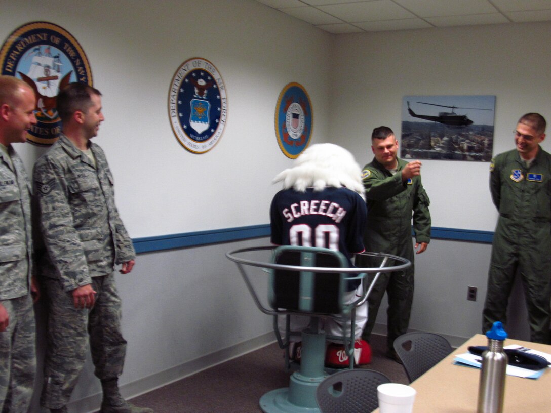 The Washington National’s baseball eagle mascot, Screech, paid a visit to the 779th Medical Group's Aerospace and Operational Physiology Flight, Joint Base Andrews  April 24, 2012. Screech’s visit included a spin in the Barany chair. The Barany chair is intended to show how an aviator can become spatially disoriented during flight. The footage shot will be shown at an upcoming baseball game on May 16. (Air Force Photo by Melanie Moore)