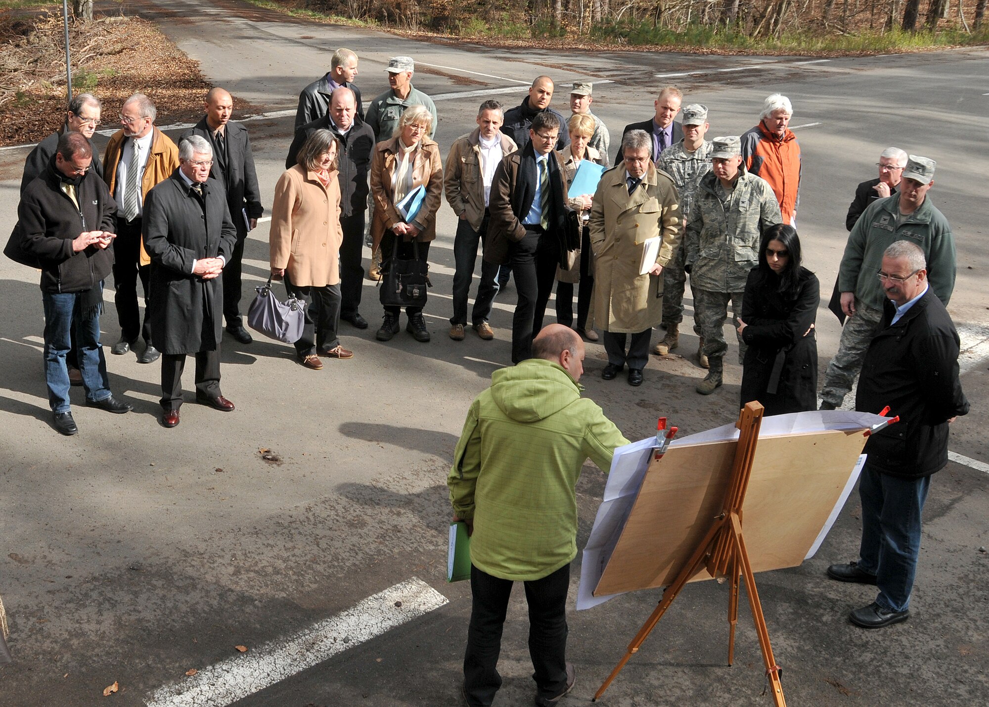 Winfried Schuch (center-front), with the construction management agency of Rheinland-Pfalz, briefs a group of German state and local government leaders on site considerations during a tour of the proposed site for the new Kaiserslautern Military Community Medical Center on the Weilerbach portion of the Rhine Ordnance Barracks, April 25, 2012. The new medical facility is scheduled to replace the Landstuhl Regional Medical Center and Ramstein Air Base Clinic upon completion. (U.S. Air Force photo by Tech. Sgt. Markus M. Maier/released)