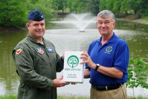 U.S.  Air Force Col. Don Godier, 20th Fighter Wing vice commander, receives the 2011 Tree City USA  award from Jimmy Walters, South Carolina Forestry Commission Urban Forester, at Shaw Air Force Base, S.C., April 20, 2012. Shaw has won this award consecutively since 1998. (U.S. Air Force photo by Airman 1st Class Hunter Brady/Released)