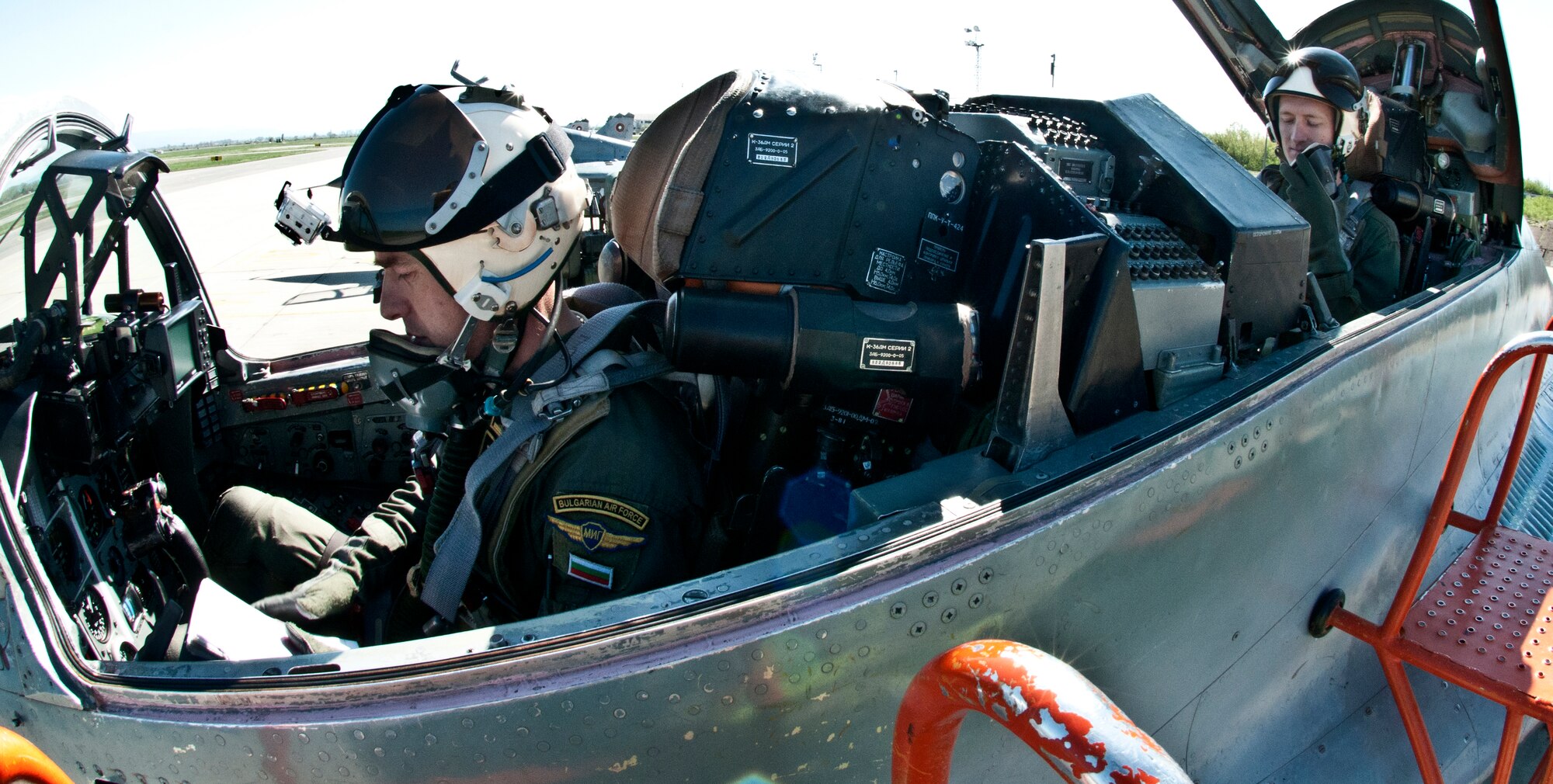 Capt. Kirby Sanford, (rear seat), 555th Fighter Squadron F-16 Fighting Falcon pilot, prepares for his flight in a Bulgarian air force MiG-29 April 19, 2012, at Graf Ignatievo Air Force Base, Bulgaria. During Thracian Star 2012, a bilateral training exercise, Aviano-based F-16 pilots are scheduled to spend more than 60 hours per week flying close air support, basic fighter and air combat maneuvers, tactical intercepts, defensive counter air and large force missions with Bulgarian MiG-21 and MiG-29 pilots. (U.S. Air Force photo/Senior Airman Katherine Windish) 