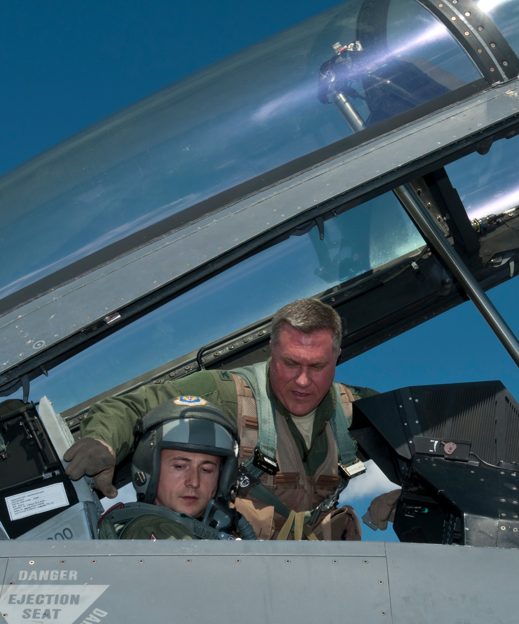Col. David Walker, 31st Operations Group and Thracian Star 2012 detachment commander, and Capt. Petar Milkov, Bulgarian air force MiG-29 pilot, prepare to fly in an F-16 Fighting Falcon April 19, 2012, at Graf Ignatievo Air Force Base, Bulgaria. Two fighter squadrons with more than two dozen aircraft and 500 personnel are deployed here from Aviano Air Base, Italy, in support of exercise Thracian Star 2012. During the exercise, Aviano F-16 Fighting Falcon pilots are scheduled to spend more than 60 hours per week flying close air support, basic fighter and air combat maneuvers, tactical intercepts, defensive counter air and large force missions with Bulgarian MiG-21 and MiG-29 pilots. (U.S. Air Force photo/Senior Airman Katherine Windish)