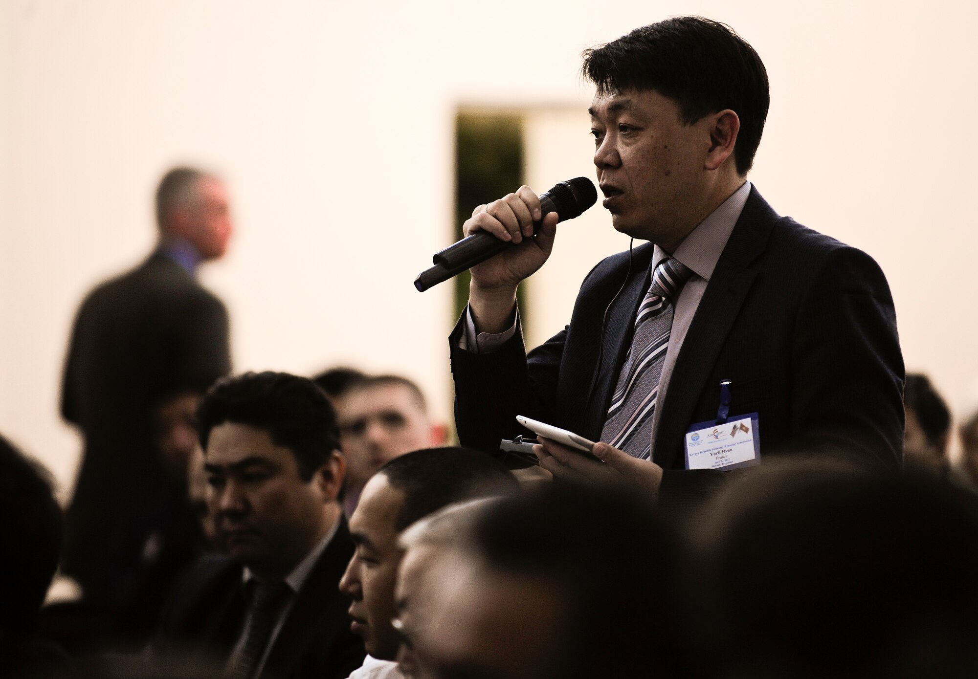 Yuri Hvan asks a question during the Kyrgyzstan Industry Training Symposium April 24, 2012, in Bishkek, Kyrgyzstan. The symposium provided instruction for business on U.S. trade and how to compete for U.S. procurement contracts. Attendees received information regarding opportunities and requirements for working with representatives of the U.S. government and designated prime vendors. Hvan is a metal-rolling plant executive director. (U.S. Air Force photo/Staff Sgt. Angela Ruiz)