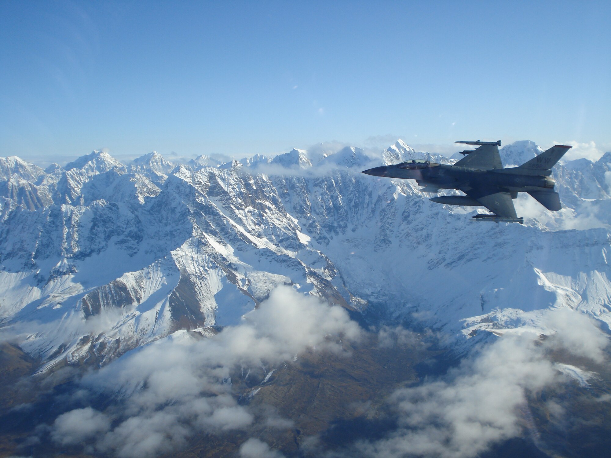 An F-16 Fighting Falcon Aircraft from the 35th Fighter Wing flies in support of Operation Noble Eagle.  Airmen from the 13 and 14 FS and AMU supported the Alaskan North American Aerospace Defense Command during the deployment.  (Courtesy Photo/Released)
