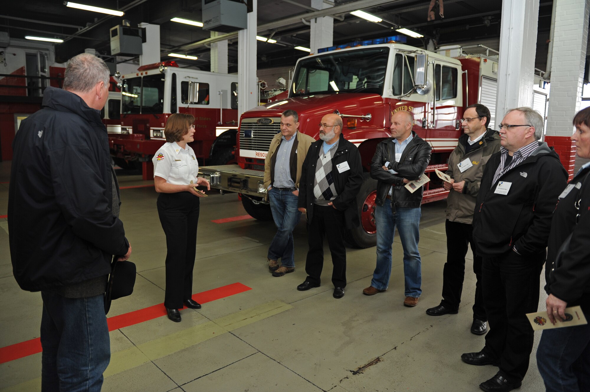 SPANGDAHLEM AIR BASE, Germany – Inge Lersch, 52nd Civil Engineer Squadron assistant fire chief of local national affairs, talks with 52nd Mission Support Group honorary commanders about the mission and responsibilities of the fire protection flight during a tour of Fire Station 1 here April 20. The honorary commanders, local German civic leaders, met with their respective squadron commanders while touring all the 52nd MSG units. The 52nd Fighter Wing partners with honorary commanders to strengthen the friendship and partnership between base members and the local communities by facilitating a better cultural exchange between the wing and the host-nation country. (U.S. Air Force photo by Airman 1st Class Matthew B. Fredericks/Released)
