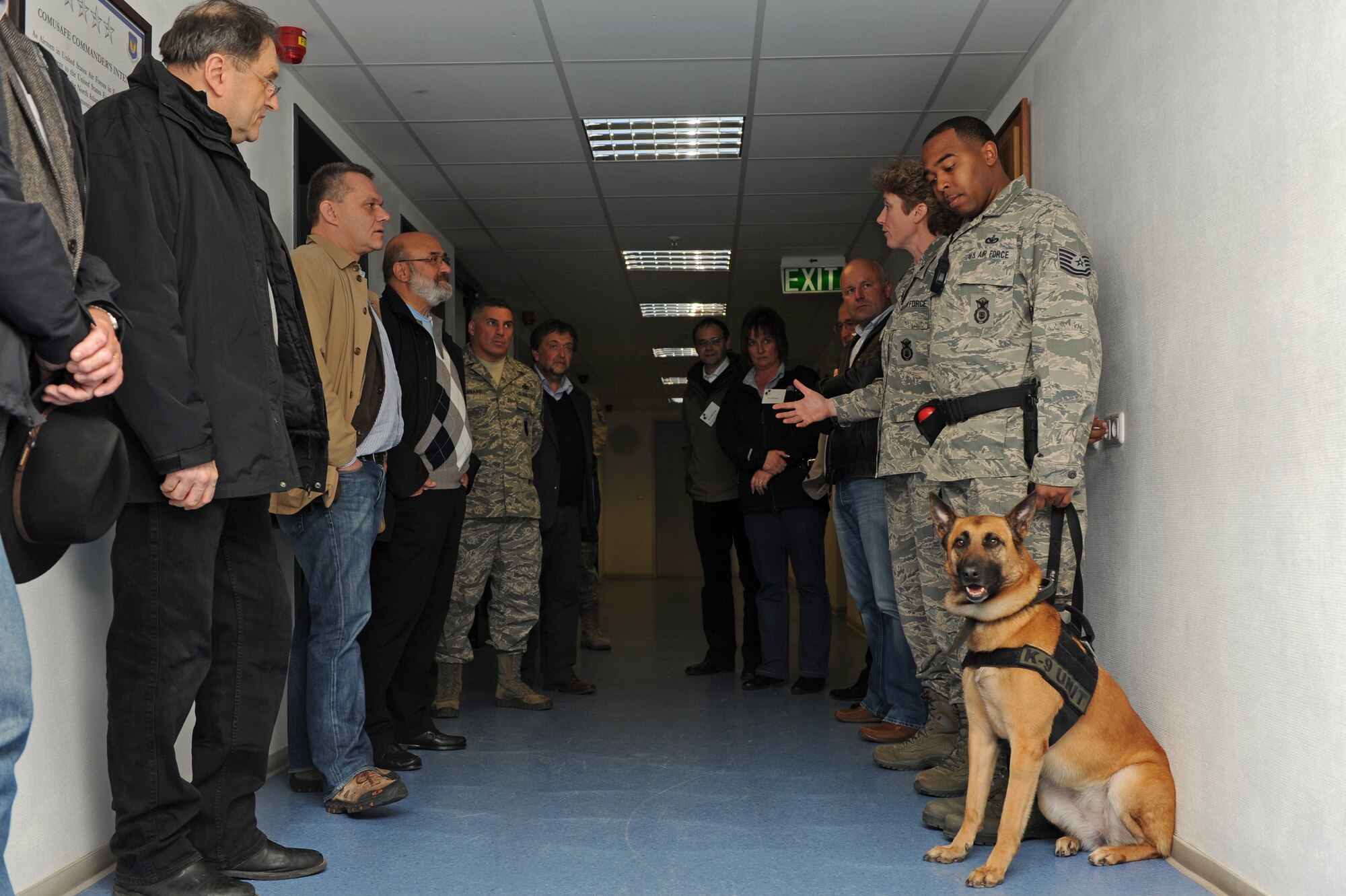 SPANGDAHLEM AIR BASE, Germany – Lt. Col. Tamara Mayer, 52nd Security Forces Squadron commander, second from right, talks with 52nd Mission Support Group honorary commanders about the roles and responsibilities of military working dogs and their handlers during a tour of Bldg. 127 here April 20. The honorary commanders, local German civic leaders, met with their respective squadron commanders while touring all the 52nd MSG units. The 52nd Fighter Wing partners with honorary commanders to strengthen the friendship and partnership between base members and the local communities by facilitating a better cultural exchange between the wing and the host-nation. (U.S. Air Force photo by Airman 1st Class Matthew B. Fredericks/Released)