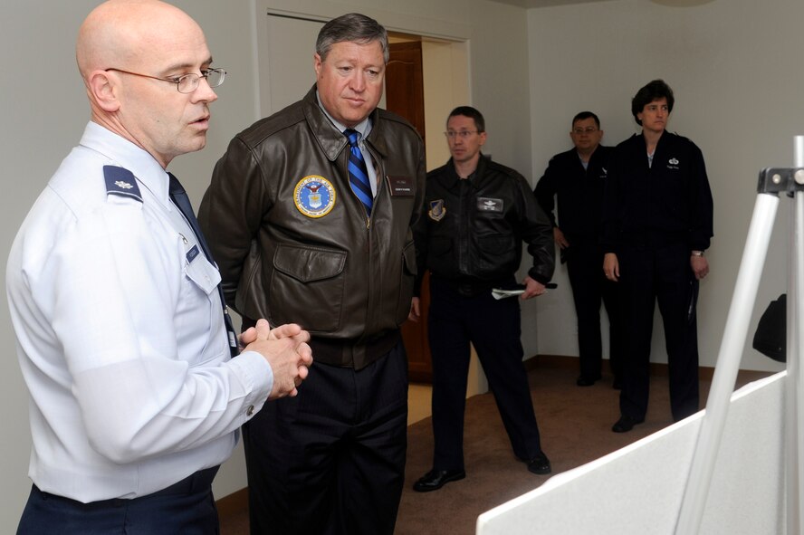 U.S. Air Force Lt. Col. Dwayne Robison, 35th Civil Engineer Squadron commander, briefs Secretary of the Air Force Michael Donley during his visit to Misawa Air Base, Japan, April 23, 2012, on the Post Acquisition Improvement Program. The brief included how the needs of the community are being addressed and how the 35th Fighter Wing is saving Air Force resources. While at Misawa, Donley met with Airmen and toured various base facilities.  (U.S. Air Force photo/Tech. Sgt. Marie Brown/Released)
