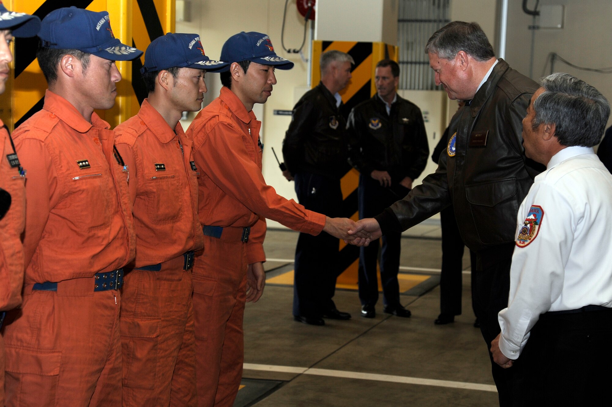 Secretary of the Air Force Michael Donley meets members of the Misawa Fire Department during a visit to Fire Station 1 at Misawa Air Base, Japan, April 23, 2012. During his visit, Fire Station 1 showcased their bilateral relationship with the local Japanese fire department.  While at Misawa, Donley met with Airmen and toured various base facilities. (U.S. Air Force photo/Tech. Sgt. Marie Brown/Released)

