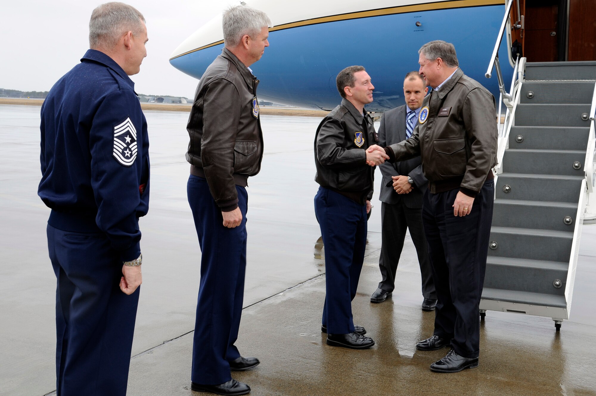 Left to right: U.S. Air Force Chief Master Sgt. Jim Laurent, 35th Fighter Wing command chief, Col. Al Wimmer, 35th FW vice commander and Col. Michael Rothstein, 35th FW commander, greet Secretary of the Air Force Michael Donley upon his arrival to Misawa Air Base, Japan, April 23, 2012. During the visit, Donley met with Airmen and toured various base facilities. (U.S. Air Force photo/Tech. Sgt. Marie Brown/Released)
