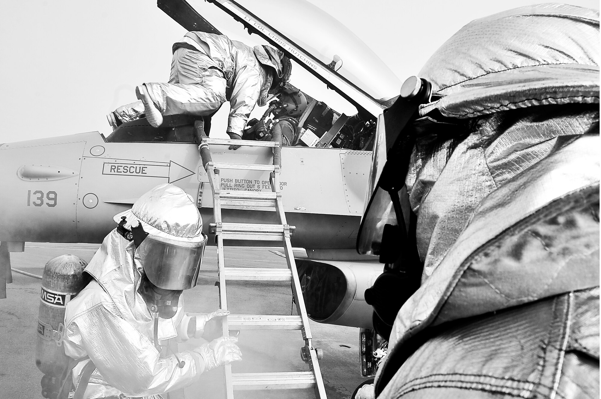 Firefighters from the 51st Civil Engineer Squadron fire department prepare to extract 1st Lt. Richard Greer III, 36th Fighter Squadron pilot, during the Operational Readiness Exercise portion of the Consolidated Unit Inspection here, April 23, 2012. The CUI aligns inspections during different leadership cycles to check for operational readiness and unit compliance. (U.S. Air Force photo/Senior Airman Adam Grant)      