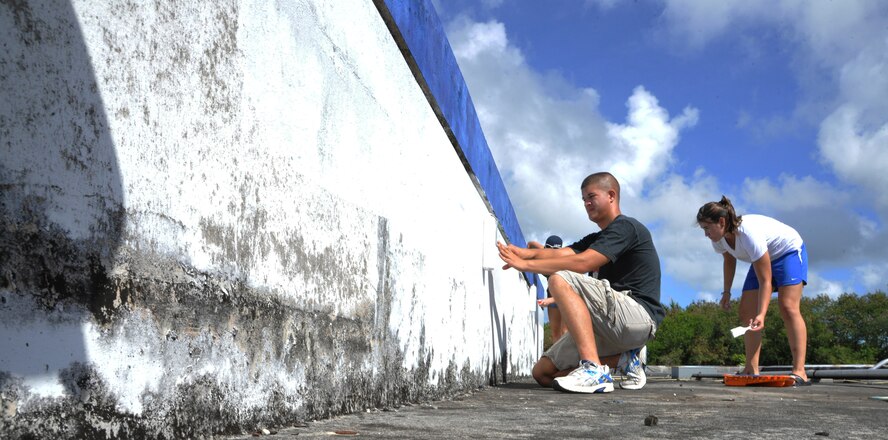 HAGATNA, Guam— Airmen from the 36th Civil Engineer Squadron repaint the M.U. Lajan Elementary School as part of the sister village program April 21. Several Airmen from the Squadron came to assist in the renovations to the school. (U.S. Air Force photo by Senior Airman Benjamin Wiseman/Released)