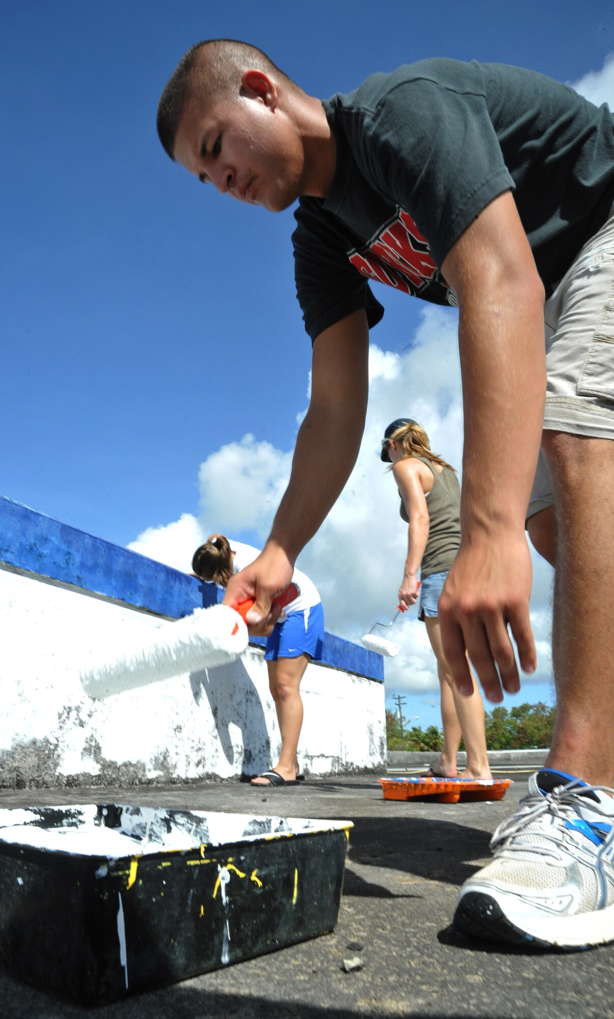 HAGATNA, Guam—Airmen from the 36th Civil Engineer Squadron repaint the M.U. Lajan Elementary School as part of the sister village program April 21. Several Airmen from the Squadron came to assist in the renovations to the school. (U.S. Air Force photo by Senior Airman Benjamin Wiseman/Released)