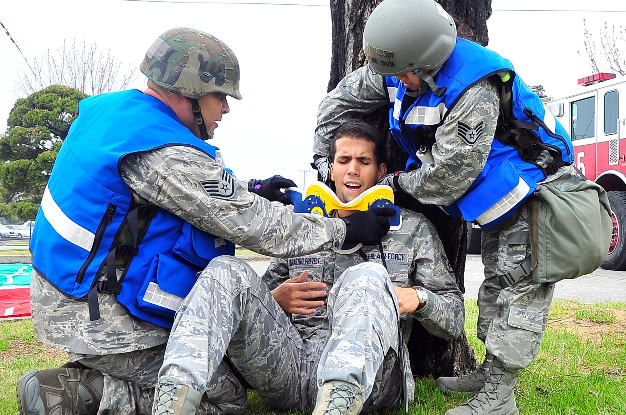 Members from the 51st Medical Operations Squadron field response team stabilize a patient by applying a neck brace during the Operational Readiness Exercise portion of the Consolidated Unit Inspection here, April 23, 2012. The CUI aligns inspections during different leadership cycles to check for operational readiness and unit compliance. (U.S. Air Force photo/Senior Airman Adam Grant)