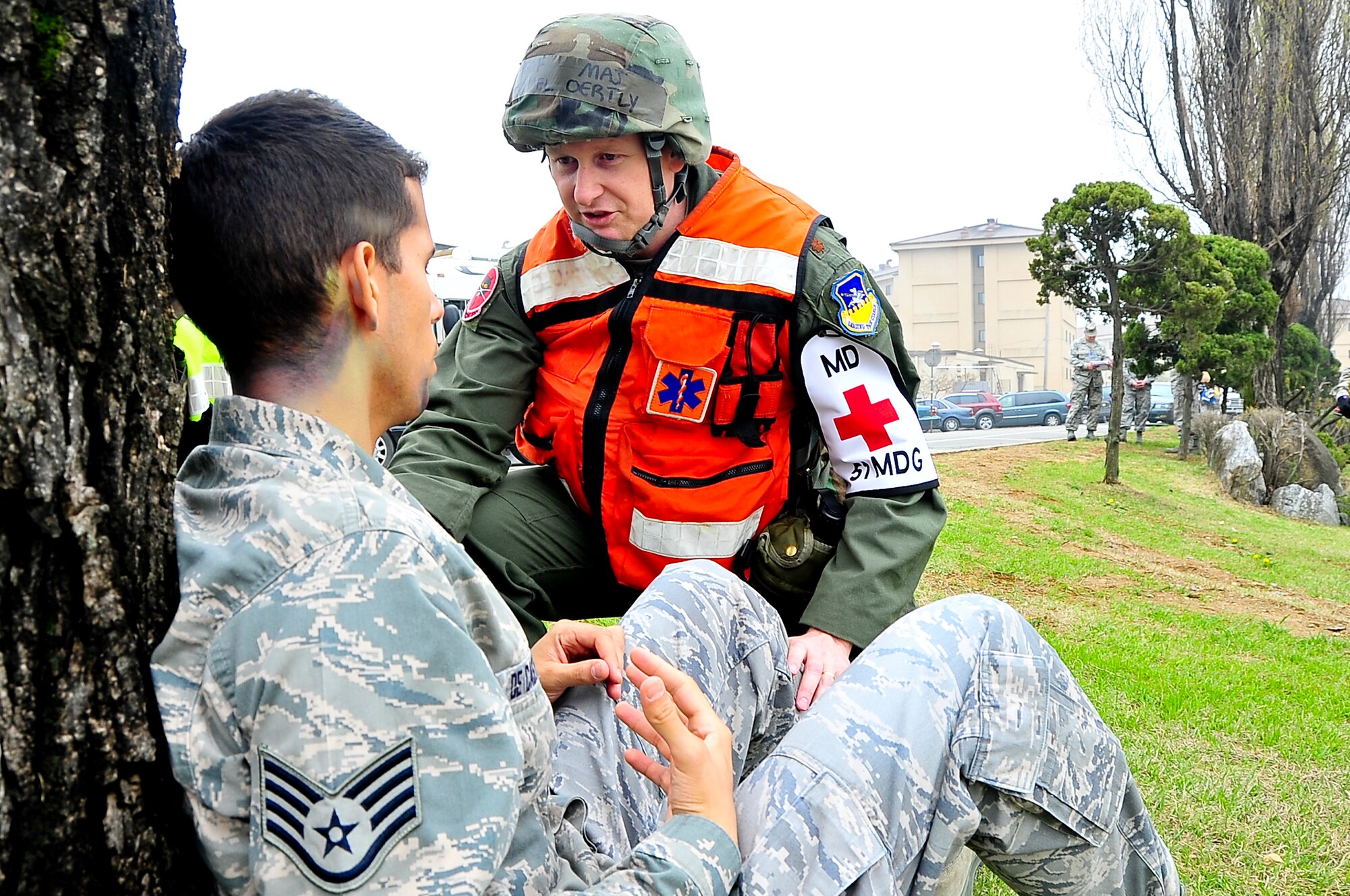 Maj. Michael Oertly, 51st Medical Group flight surgeon, assesses injuries after a simulated bus crash during the Operational Readiness Exercise portion of the Consolidated Unit Inspection here, April 23, 2012. The CUI aligns inspections during different leadership cycles to check for operational readiness and unit compliance. (U.S. Air Force photo/Senior Airman Adam Grant)