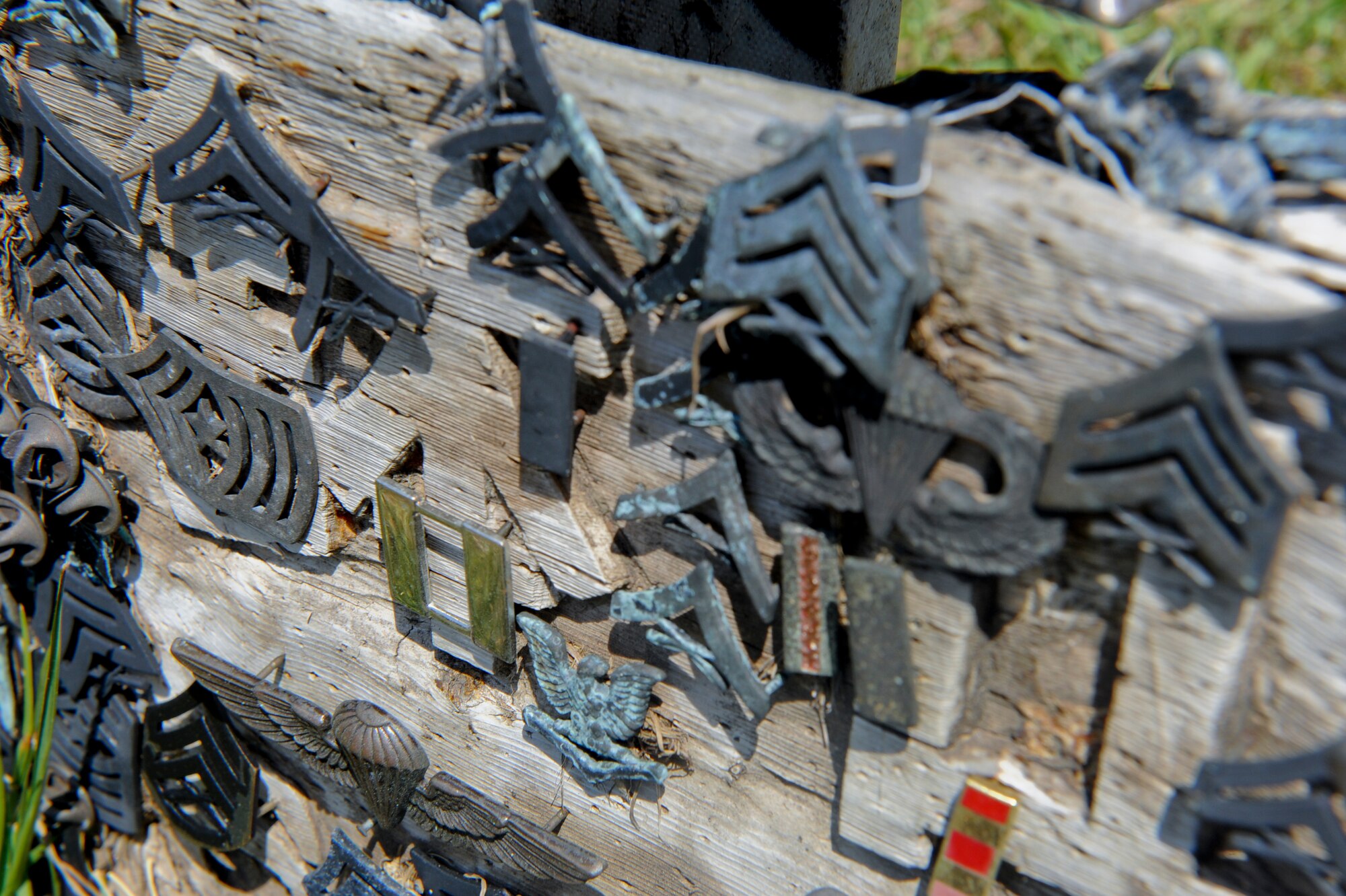 U.S. Marine collar rank insignias are left on top of Mount Suribachi as a sign of respect at Iwo To, formally known as Iwo Jima, Japan, March 30, 2012. Members of the Kadena Air Base, Japan, 18th Operation Group visited the island as part of a military professional education experience. (U.S. Air Force photo by Airman 1st Class Brooke P. Beers/Released)