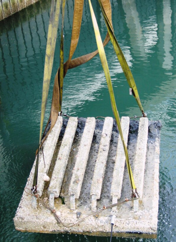 Divers from Portland and San Francisco districts helped move two 3500-pound zinc anode sleds to get a dredging job back on track.

The district dredging team, contracting and budget staff, survey crews and the Coast Guard collaborated to fix the potential hazard at the Coast Guard boathouse. The sleds, which minimize corrosion of the steel pilings, had slid out of place during earlier dredging. Divers passed the rigging to crews onto a  dredging tugboat, which then pulled the blocks from the water and were then lifted to the docks by a Coast Guard boat hoist. Dredging resumed within 72 hours and quickly wrapped up.

Using Corps divers to rig the sleds for hoisting out of the water saved the project thousands of dollars in delay charges and the time and money for a dive contract.


