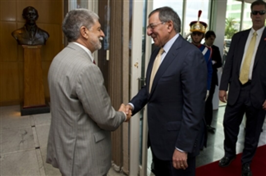 Secretary of Defense Leon E. Panetta greets Brazilian Minister of Defense Celso Amorim in Brasilia, Brazil, April 24, 2012.  Panetta is on a five-day trip to the region to meet with counterparts and military officials in Brazil, Colombia and Chile to discuss an expansion of defense and security cooperation.  