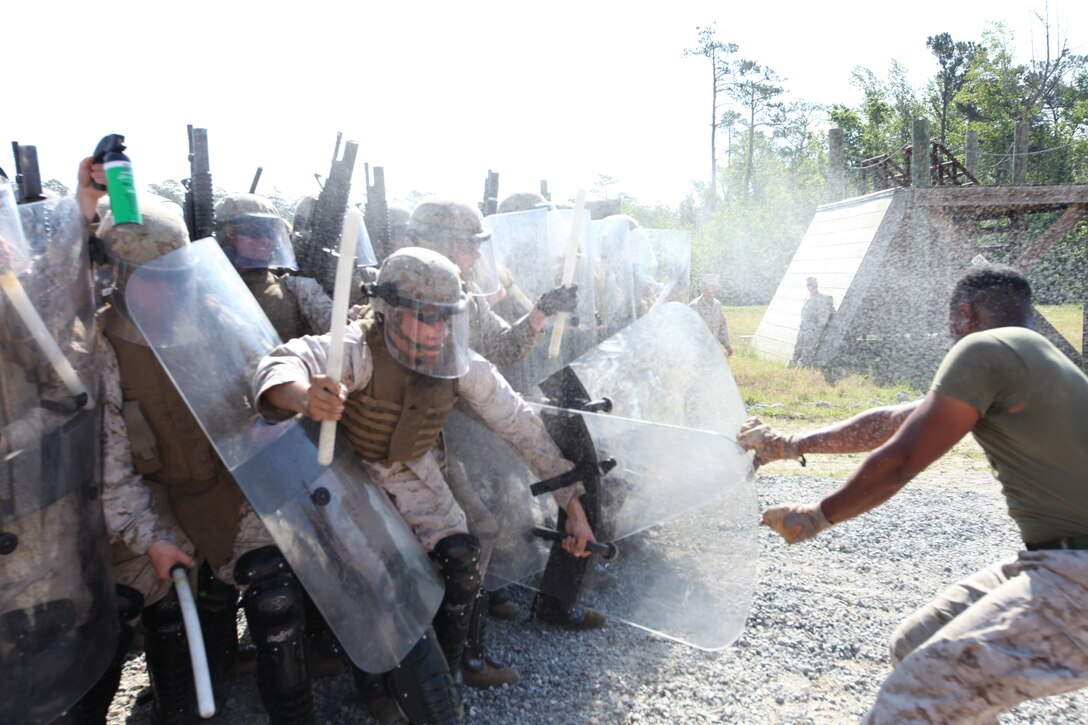 U.S. Marines from the ground combat element for Security Cooperation Task Africa Partnership Station 12 (APS-12), conduct scenario based riot control exercises against their fellow U.S. Marines aboard Stone Bay, N.C., April 26, 2012. This training is part of APS-12's special operations capabilities certification in support of their upcoming deployment to Africa.
