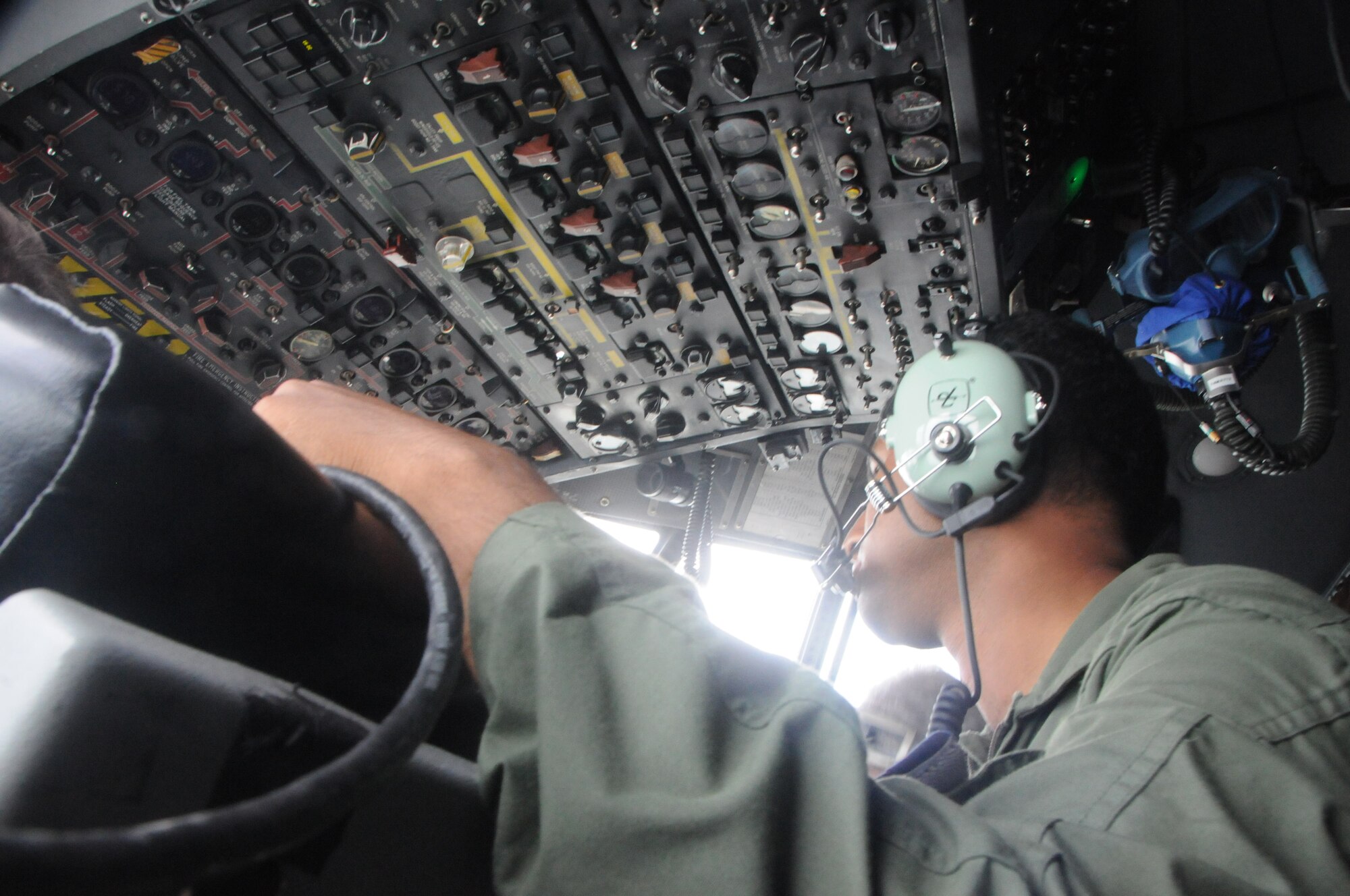 Bangladesh Air Force Sgt. Mohammad Moniruzzaman, flight engineer, sits in the C-130H flight engineer seat during a flight in support of exercise Cope South 2012 at Kurmitola Air Base, Bangladesh, on April 25, 2012. During Cope South 2012, U.S. and Bangladesh Air Force exchange airlift, air-land, and airdrop delivery techniques that enhance the ability to respond to regional disasters. Exercise Cope South 12 is a bilateral tactical airlift exercise conducted between the two air forces scheduled through April 26, 2012.  (U.S. Air Force photo/1st Lt Cammie Quin)
