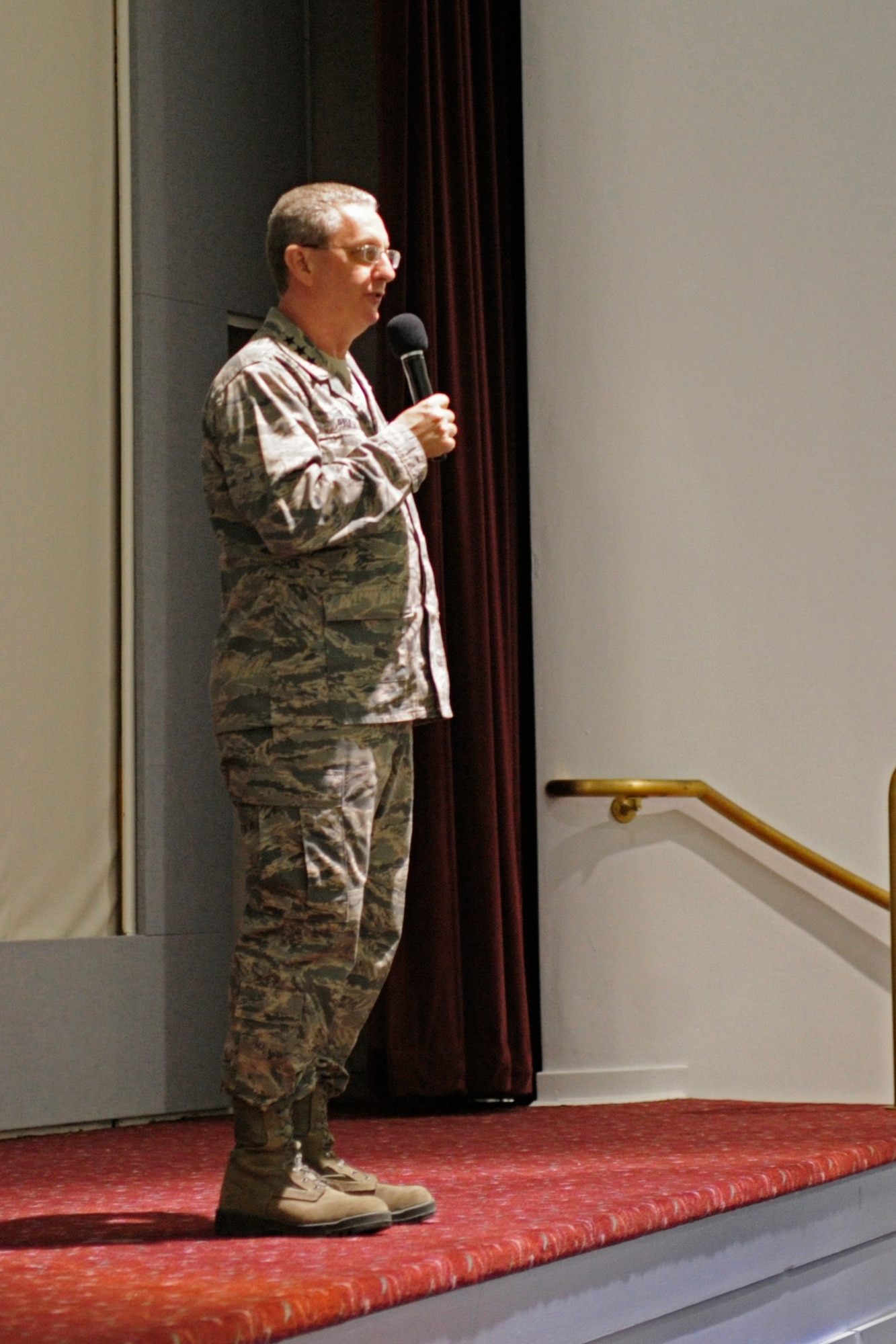 Lt. Gen. Mark Ramsay, 18th Air Force commander, speaks to a group of McChord Field Airmen during an all call April 26, 2012, at Joint Base Lewis-McChord, Wash. After speaking of 62nd Airlift Wing successes, future budget cuts and JBLM resources, General Ramsay closed with an emphasis on the Wingmanship and working together as a team. (U.S. Air Force photo/Adamarie Lewis-Page)