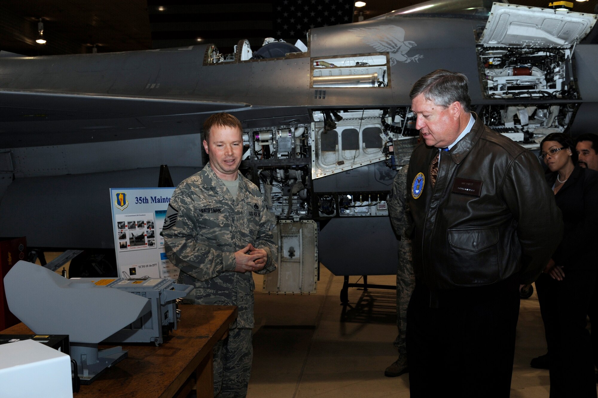 U.S. Air Force Master Sgt. Andrew Kauffman, left, 35th Maintenance Group avionics manager, briefs Secretary of the Air Force Michael Donley during his visit to Misawa Air Base, Japan, April 23, 2012. Donley was briefed on the capabilities the 35th Maintenance Group provides to the 35th Fighter Wing, its teamwork with Pacific Air Forces Command and Air Force Materiel Command, and the challenges with maintenance manning. (U.S. Air Force photo/Tech. Sgt. Marie Brown/Released)
