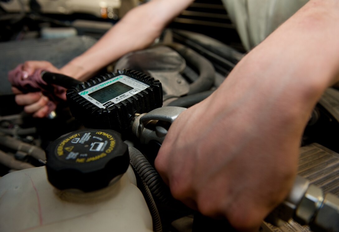 Airman 1st Class Dillion Rickman, 28th Logistics Readiness Squadron vehicle and vehicular equipment mechanic, uses an oil pump during an oil change in the vehicle maintenance shop at Ellsworth Air Force Base, S.D., April 24, 2012. Routine oil changes are required approximately every 3,000 miles to ensure that all the government vehicles on base stay operationally ready. (U.S. Air Force photo by Airman 1st Class Kate Thornton/Released)