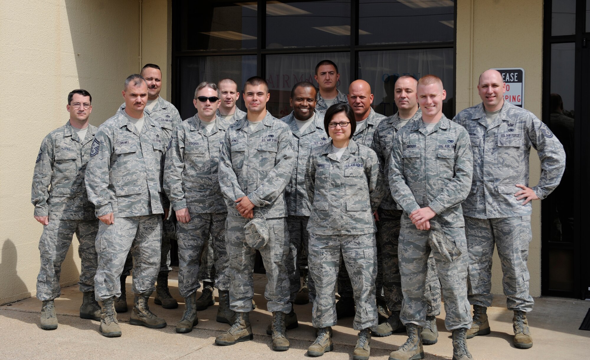 Members of the Barksdale First Sergeant Council pose with Diamond Sharp award winners Senior Airman Austin Groupp, 2nd Maintenance Squadron, and Airman 1st Class Garrett Jones, 2nd Aircraft Maintenance Squadron, in front of the Airman's Attic on Barksdale Air Force Base, La., April 26. The Diamond Sharp award, used to recognize outstanding Airmen, was presented to the two Airmen this month for the volunteer work they did for the Airman's Attic. (U.S. Air Force photo/Airman 1st Class Benjamin Gonsier)(RELEASED)
