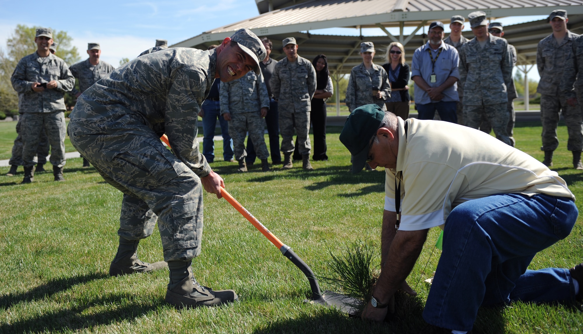 U.S. Air Force Capt. Austin Lovejoy, 366th Civil Engineer Squadron, poses for a picture as a new tree is planted for Arbor Day April 25, 2012, Mountain Home Air Force Base, Idaho. Arbor Day began in Nebraska in 1872 .  (U.S. Air Force photo/ Airman 1st Class Jonathan Glanville)