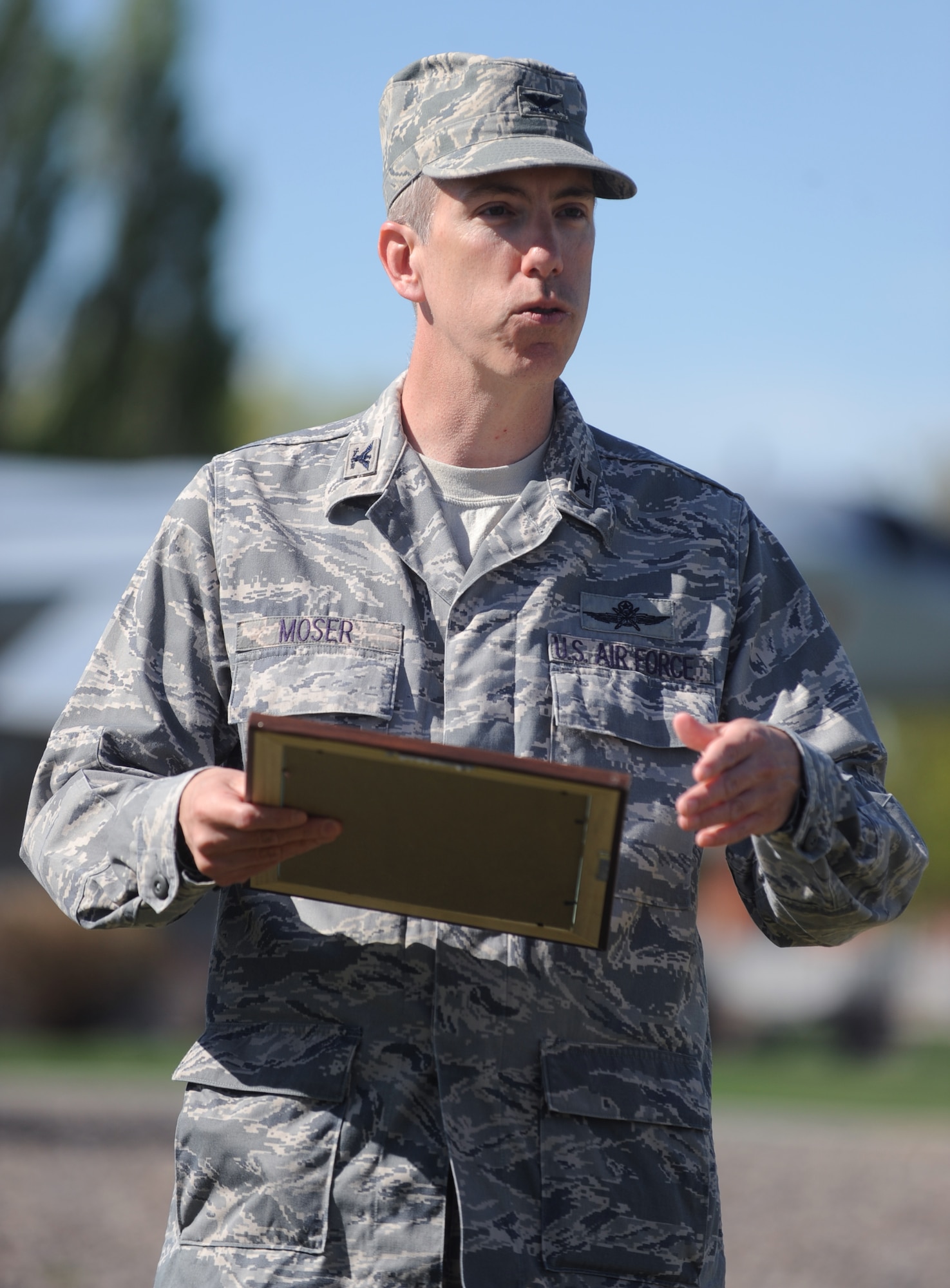 U.S. Air Force Col. Scott Moser, 366th Mission Support Group commander, reads a plaque about how Arbor Day began April 25, 2012, Mountain Home Air Force Base, Idaho. The Arbor Day celebration on base is in its fifteenth year. (U.S. Air Force photo/Airman 1st Class Jonathan Glanville)