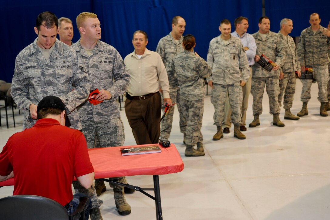 Service members from Langley Air Force Base, Va., wait in line on base to get an autograph and meet NASCAR driver Ricky Stenhouse, Jr. during the military appreciation barbecue hosted by the 633rd Force Support Squadron, April 26, 2012. During the lunch, Service members were able to get a close look at Stenhouse’s car, as well as win tickets to his next race in Richmond, Va. (U.S. Air Force photo by Senior Airman Wesley Farnsworth/Released)