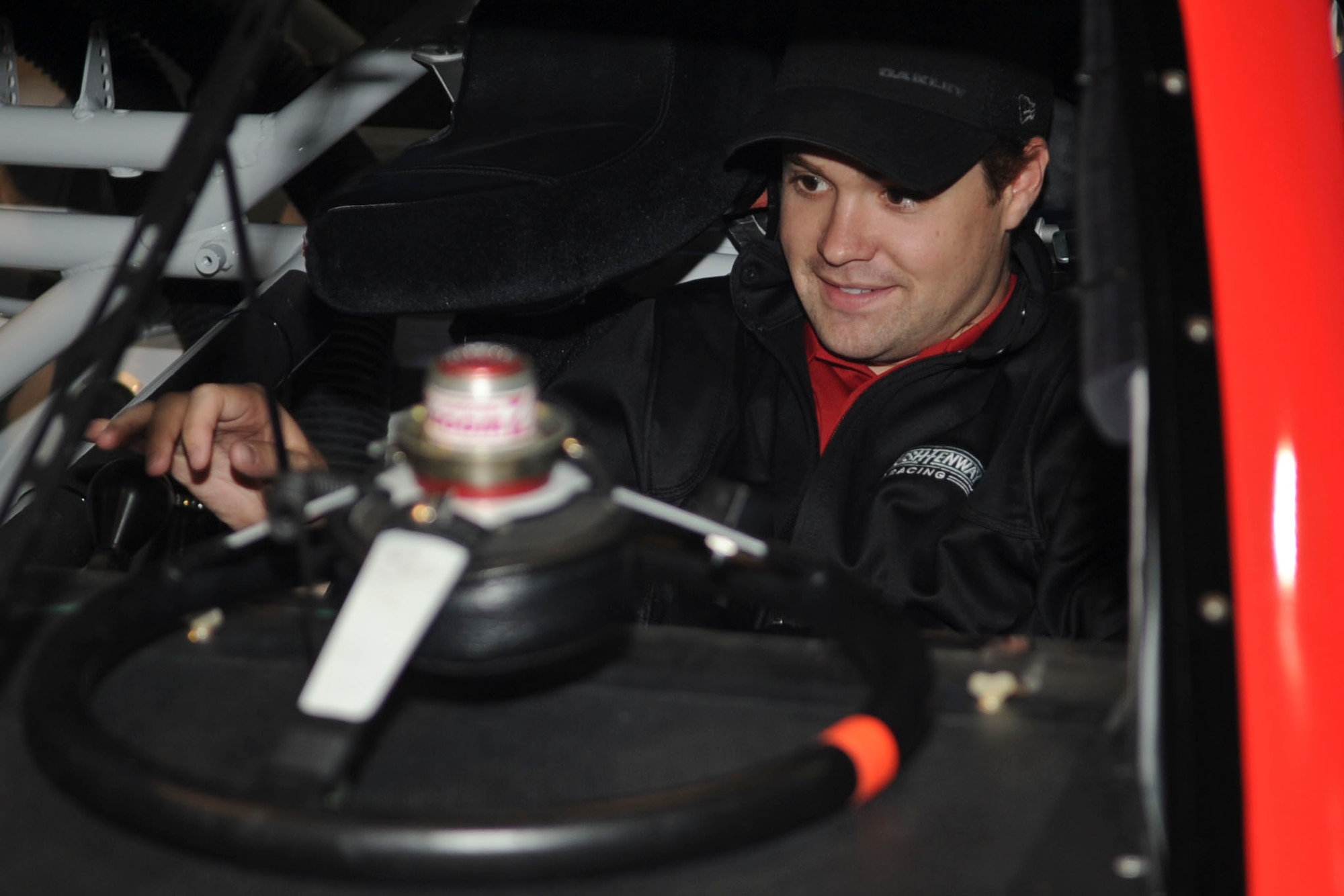 NASCAR driver Ricky Stenhouse, Jr., revs the engine of his race car for members of Langley Air Force Base, Va., during a military appreciation lunch, April 26, 2012. During the lunch, hosted by the 633rd Force Support Squadron, Service members were able to meet Stenhouse, have items autographed and get close to his car. (U.S. Air Force photo by Senior Airman Wesley Farnsworth/Released)