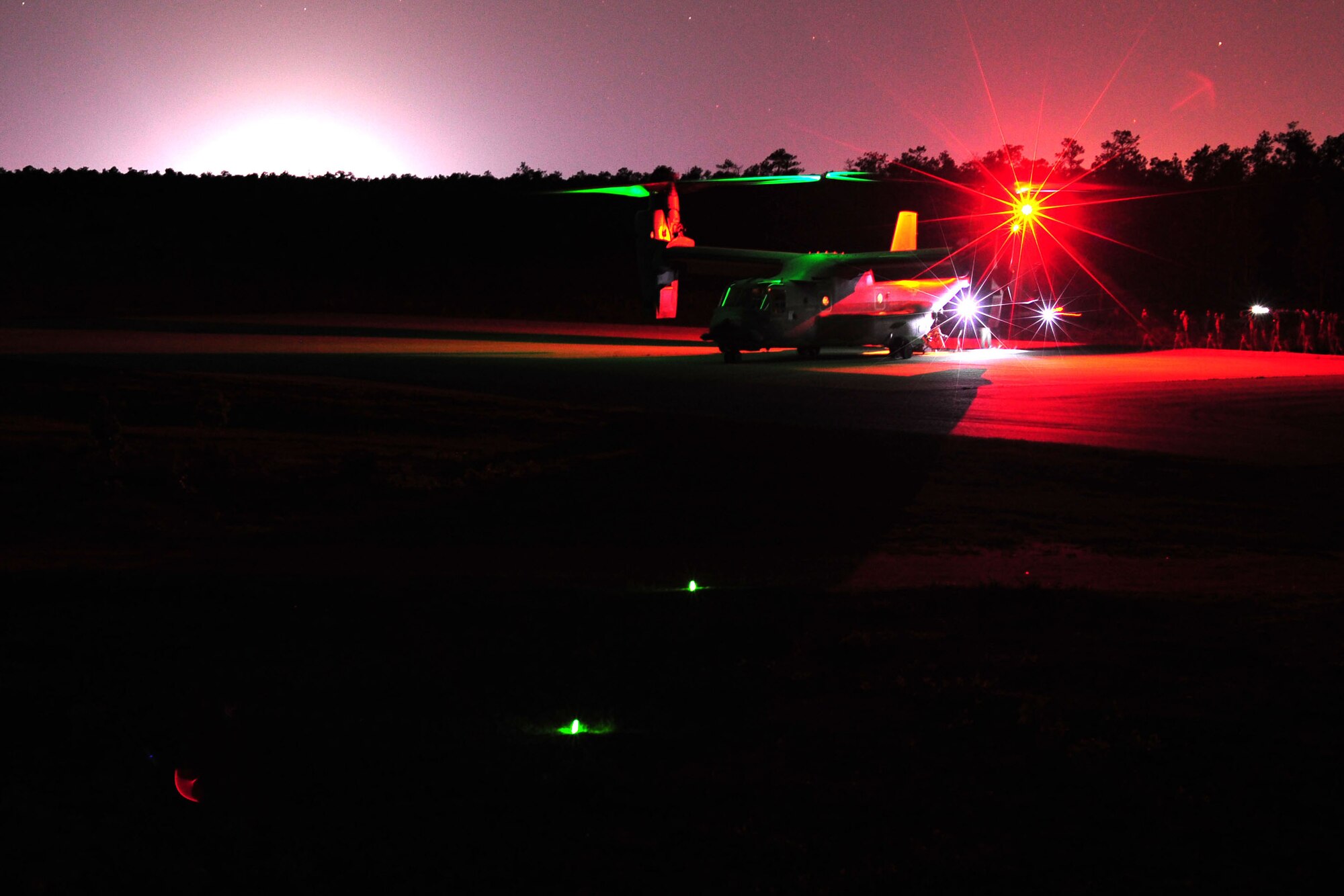 Joint Civilian Orientation Conference attendees board a CV-22 Osprey from the 8th Special Operations Squadron following an air power demonstration on Eglin Range, Fla., April 23, 2012.  JCOC is a Secretary of Defense-sponsored program that gives civilian community leaders the opportunity to learn about the military and national defense. (U.S. Air Force photo/Airman 1st Class Gustavo Castillo)(Released)