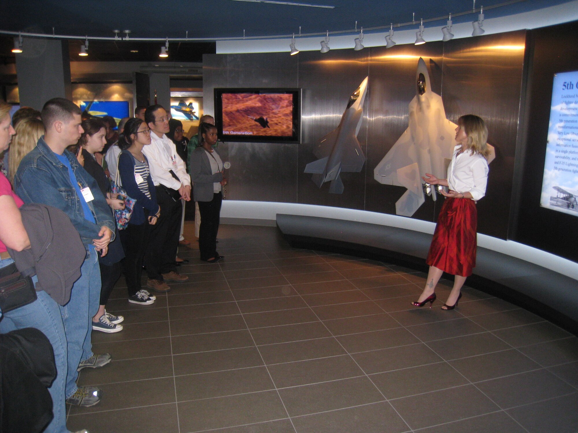 Heather Penney, Air National Guard pilot and Lockheed Martin program director, briefs “Air Force STEM 2020 Challenge” winners on fifth generation fighter technology at the Pentagon April 20. The 317th Recruiting Squadron’s “Air Force STEM 2020 Challenge” was an essay contest designed to inspire innovation and creativity in science, technology, engineering and math programs. Eighteen Air Force STEM 2020 Challenge essay contest winners from Virginia, Maryland and District of Columbia schools were invited to the Pentagon April 20 for a day of learning about innovation in the Department of Defense. (U.S. Air Force photo)
