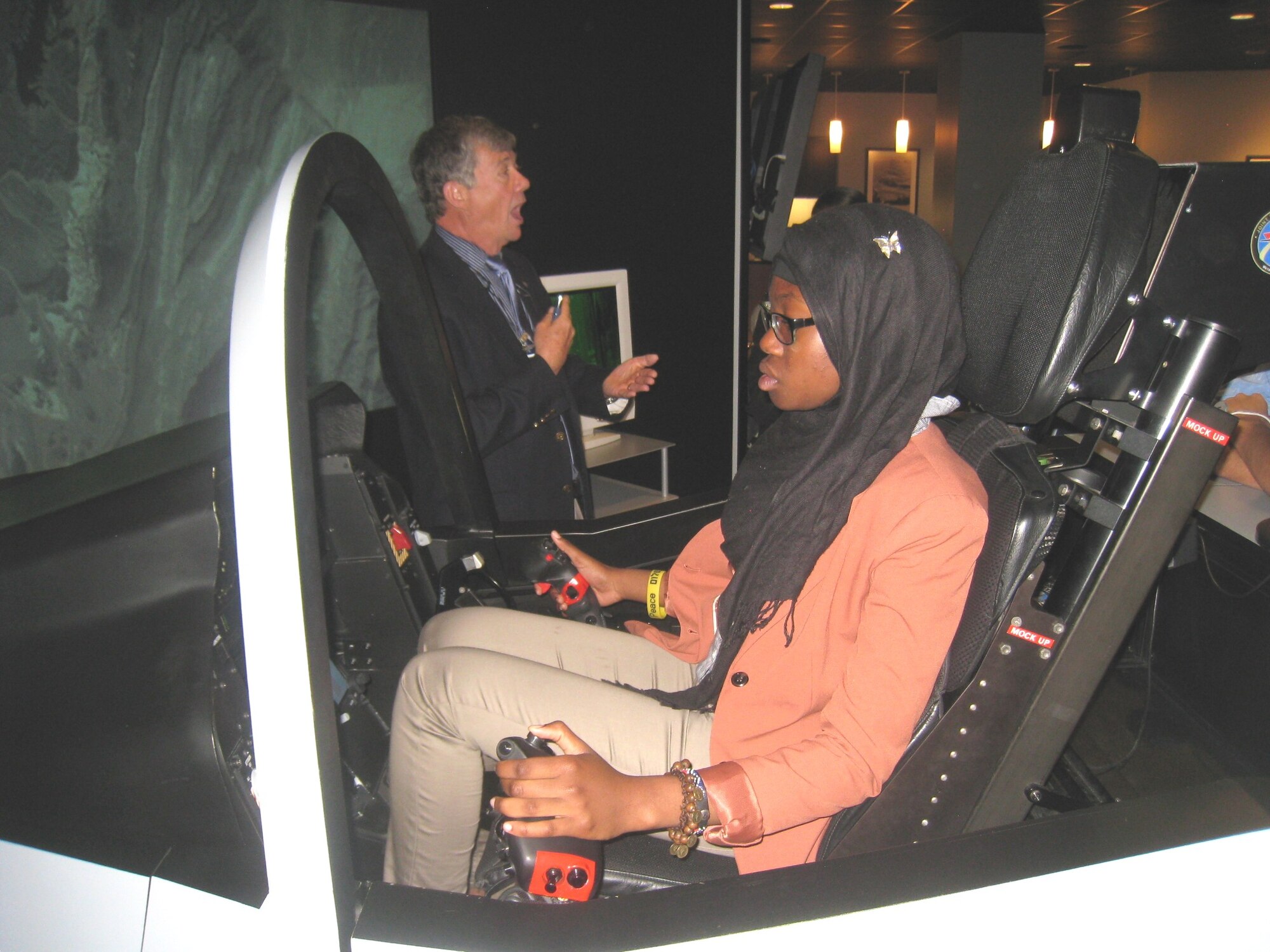 Mariam Cocker, an “Air Force STEM 2020 Challenge” contest winner from Eleanor Roosevelt high school in Maryland, takes the controls of an F-35 Simulator, instructed by a Lockheed Martin Fighter Demonstration Center representative. The 317th Recruiting Squadron’s “STEM 2020 Challenge” was an essay contest designed to inspire innovation and creativity in science, technology, engineering and math programs. Eighteen “Air Force STEM 2020 Challenge” essay contest winners from Virginia, Maryland and District of Columbia schools were invited to the Pentagon April 20 for a day of learning about innovation in the Department of Defense. (U.S. Air Force photo)