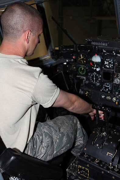 Senior Airman Kenneth Koot, 911th Maintenance Squadron, sets the breaks on a C-130H2 Hercules which enables other maintainers to work on the aircraft’s hydraulic system, April 23, 2012. This particular C-130 is an active duty aircraft received from Little Rock AFB, Ark., on April 9, and is currently undergoing the isochronal inspection at the base. (U.S. Air Force photo by Tech. Sgt. Ralph Van Houtem/ Released)