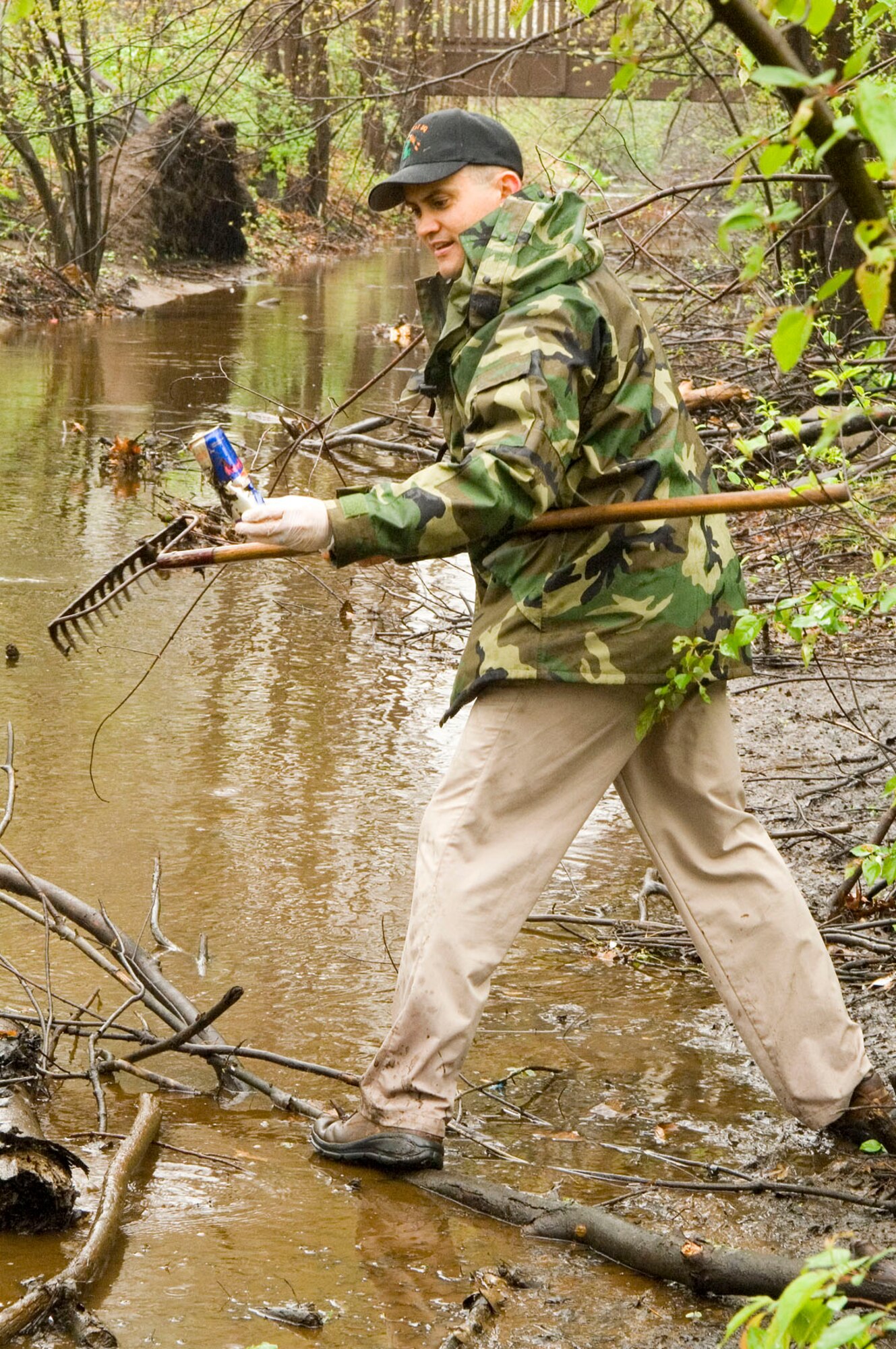 HANSCOM AIR FORCE BASE, Mass. – Lt. Col. David McIllece, 46th Test Squadron Det. 1 commander, pulls trash from the Shawsheen River during the base’s Earth Day Cleanup April 23. Volunteers from across the base took part in cleaning up Hanscom’s wetland and Shawsheen River areas. (U.S. Air Force photo by Mark Wyatt)