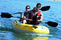 A three man raft team makes their way back to shore after completing the rafting course at Laughlin’s Southwind Marina on Lake Amistad April 21, 2012 in the eighth annual Adventure Race.  This year’s Adventure Race consisted of 23.3 miles of biking, a 5.3 mile run and a 1,200 meter three person rafting race. (U.S. Air Force photo/Senior Airman Scott Saldukas)