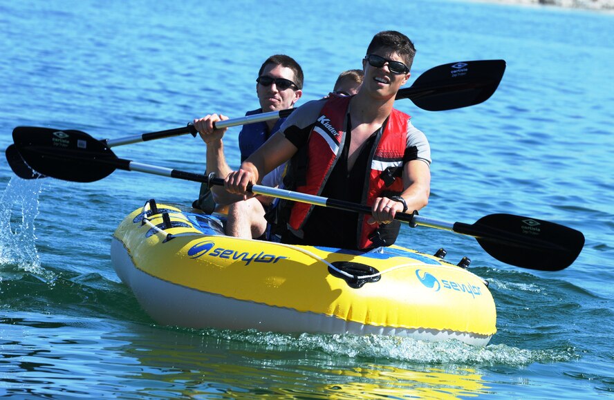 A three man raft team makes their way back to shore after completing the rafting course at Laughlin’s Southwind Marina on Lake Amistad April 21, 2012 in the eighth annual Adventure Race.  This year’s Adventure Race consisted of 23.3 miles of biking, a 5.3 mile run and a 1,200 meter three person rafting race. (U.S. Air Force photo/Senior Airman Scott Saldukas)