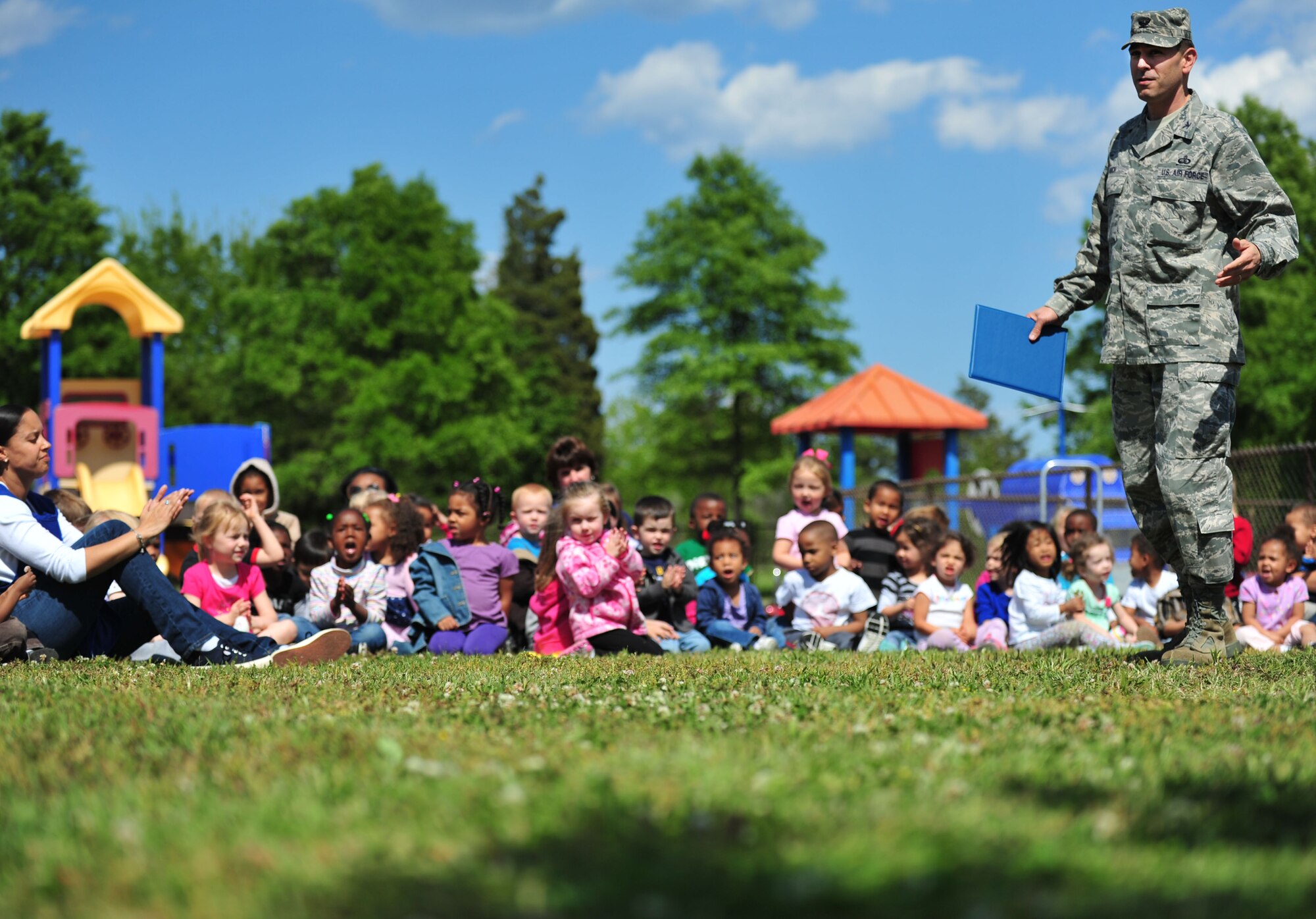 U.S. Air Force Col. Korvin Auch, 633rd Air Base Wing commander, speaks to children at the Langley Air Force Base, Va., child development center, April 25, 2012. Auch discussed the importance of taking care of the planet before helping the children plant a tree in honor of National Arbor Day. (U.S. Air Force photo by Senior Airman Jarad A. Denton/Released)