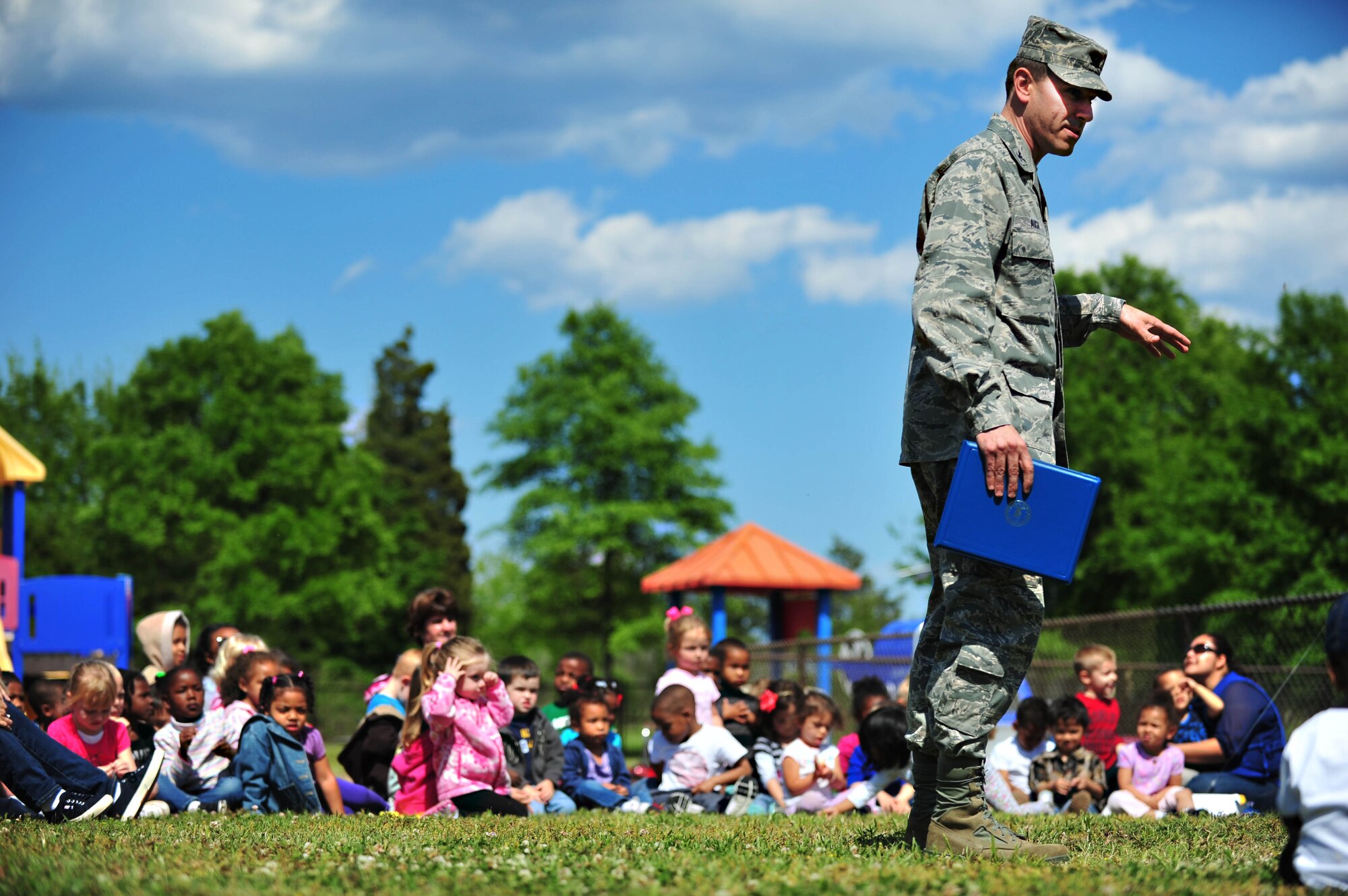 U.S. Air Force Col. Korvin Auch, 633rd Air Base Wing commander, speaks to children at the Langley Air Force Base, Va., child development center, April 25, 2012. Auch visited the CDC in order to help the children plant a tree in preparation for National Arbor Day, April 27. (U.S. Air Force photo by Senior Airman Jarad A. Denton/Released) 